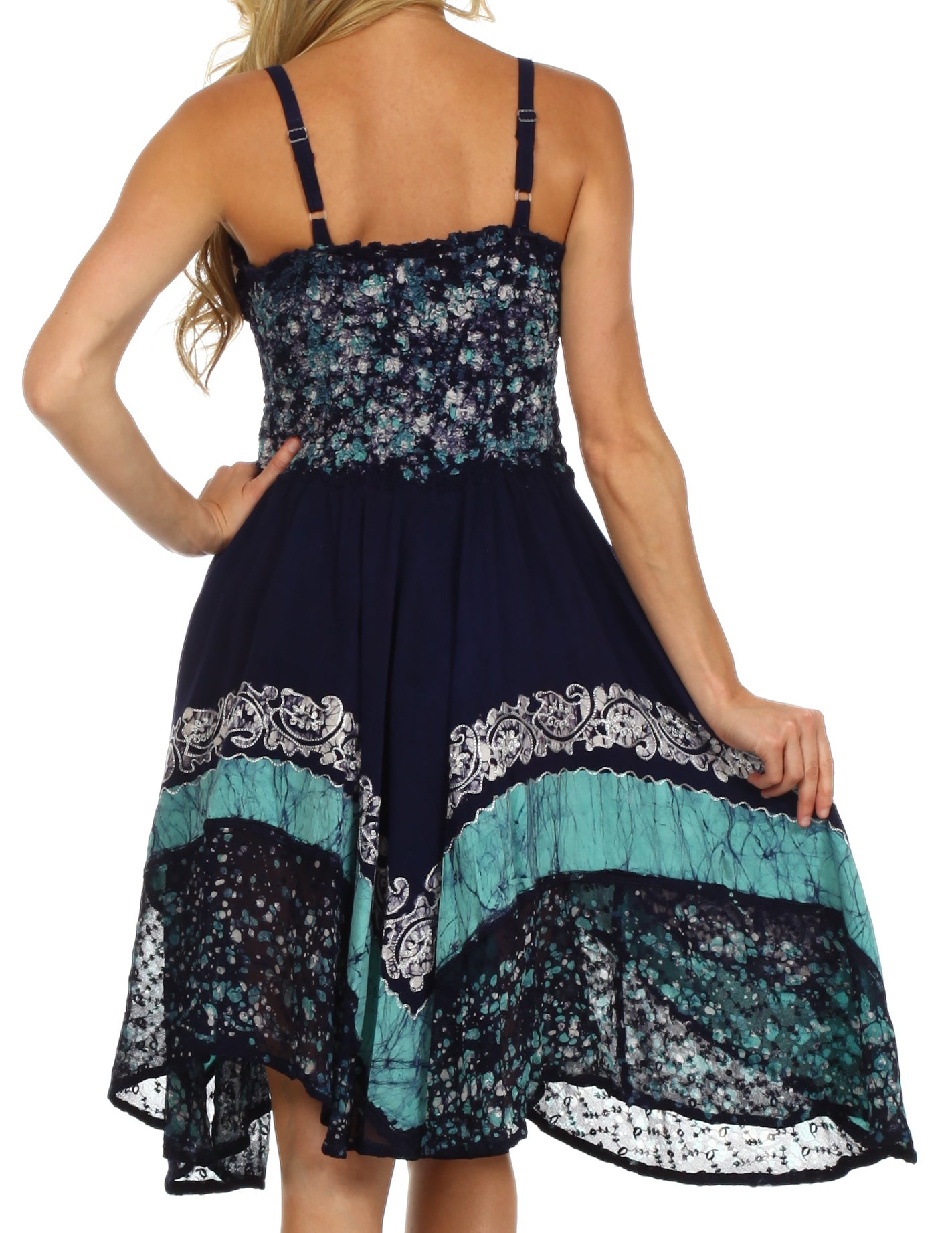 Navy blue and teal floral dress with lace details on a white background