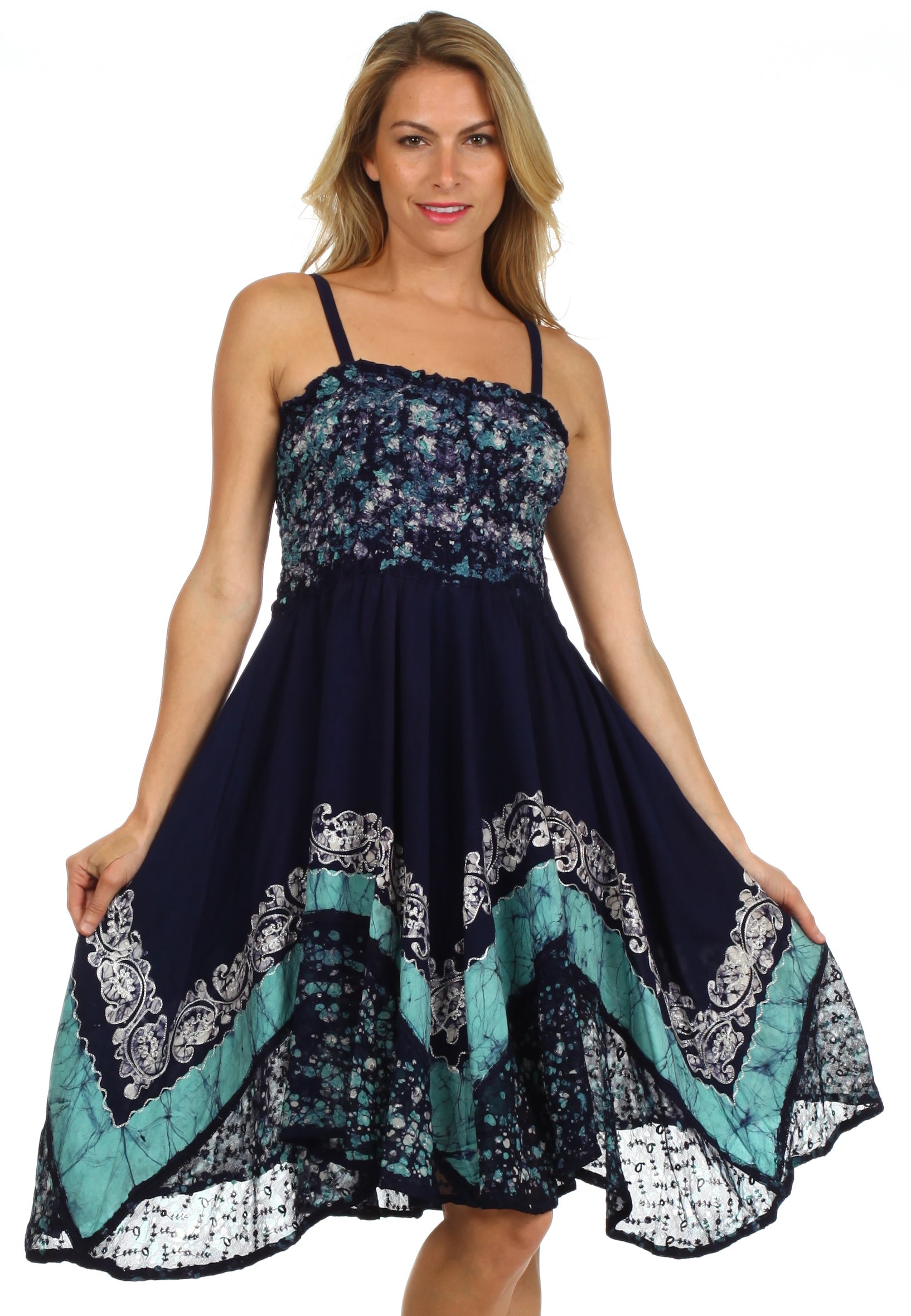 Woman wearing a navy floral dress with turquoise accents on a white background