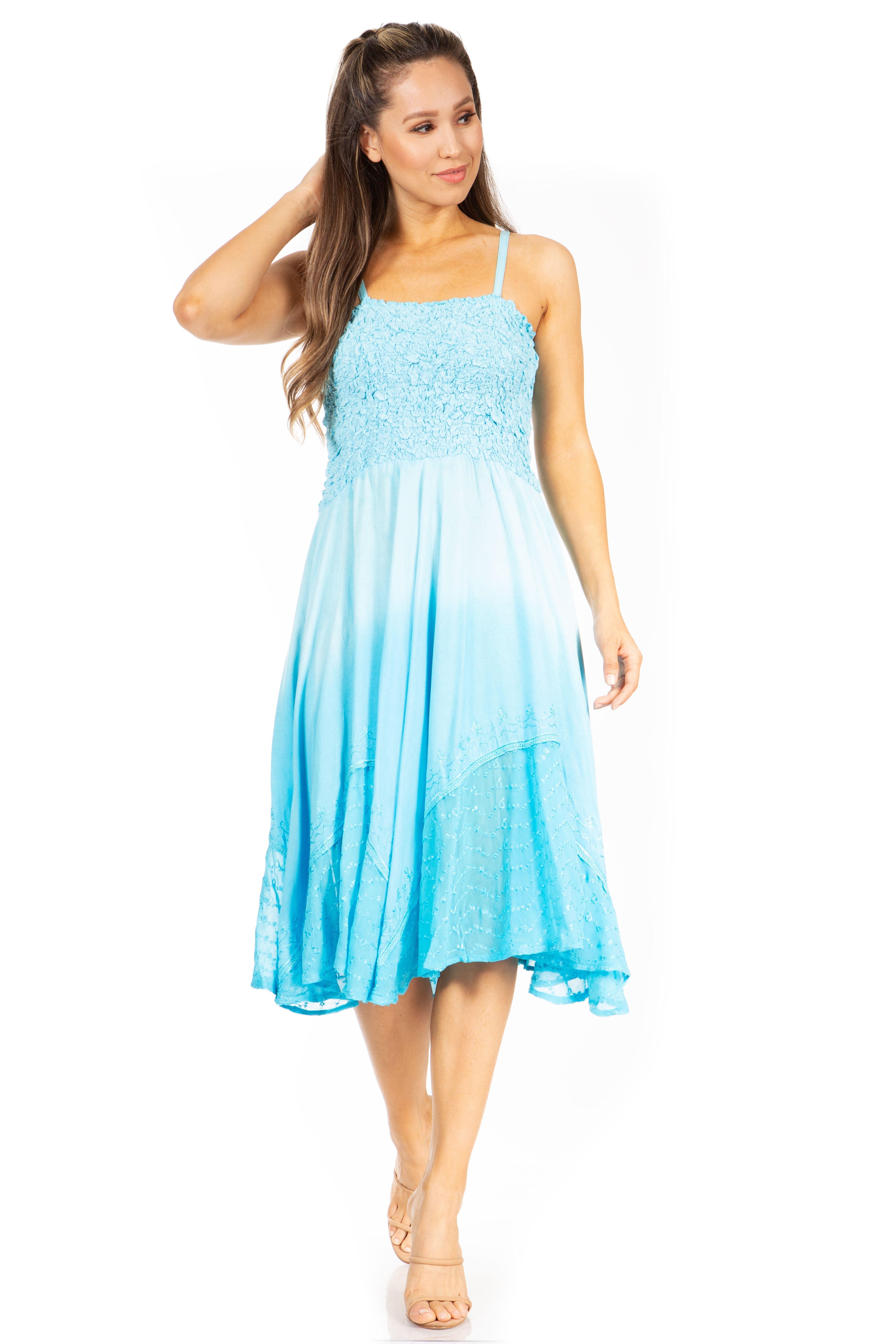 Woman wearing a light blue dress on a white background