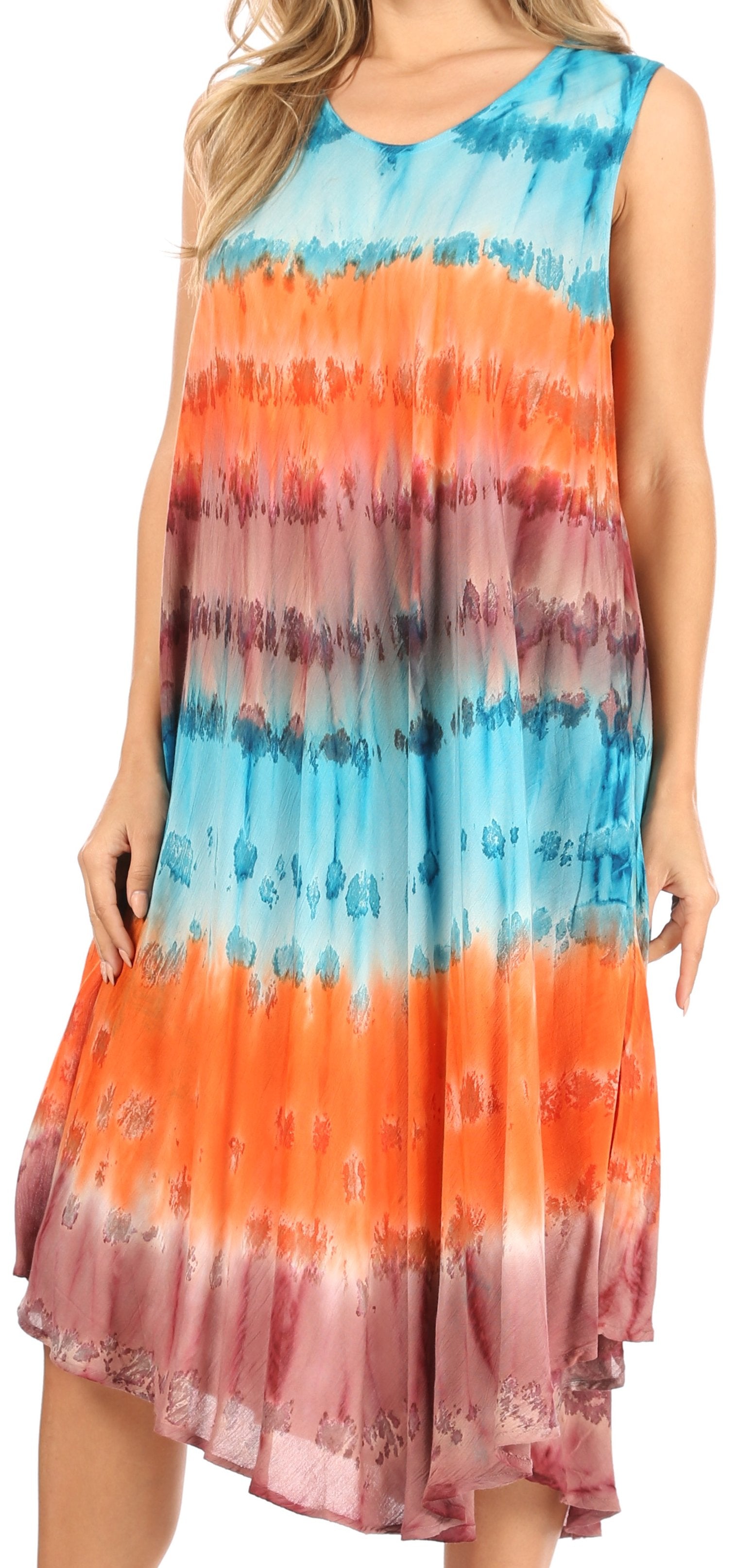 Woman wearing a tie-dye dress with blue, orange, and pink gradient.