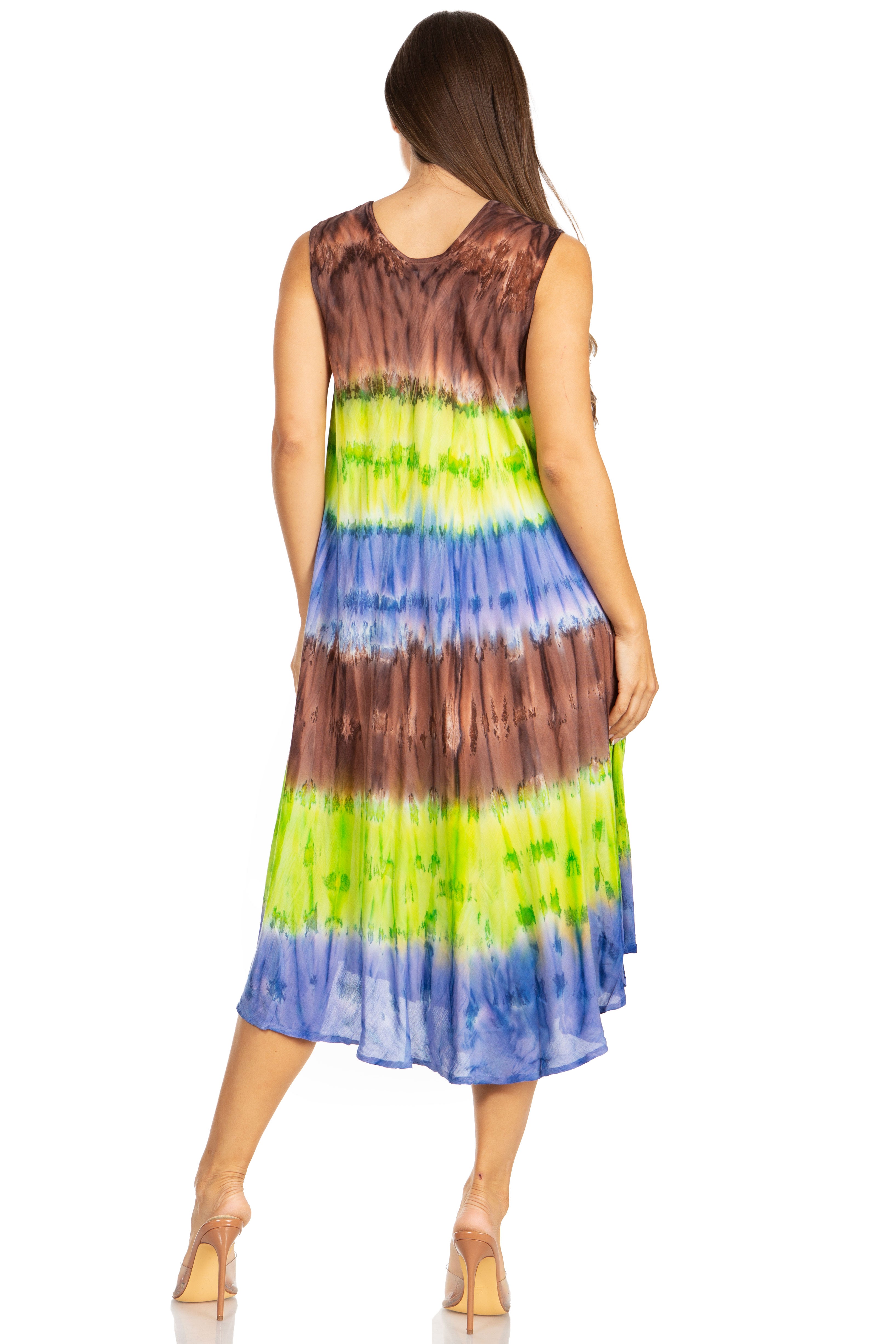 Woman wearing a tie-dye dress with brown, green, and blue colors on a white background