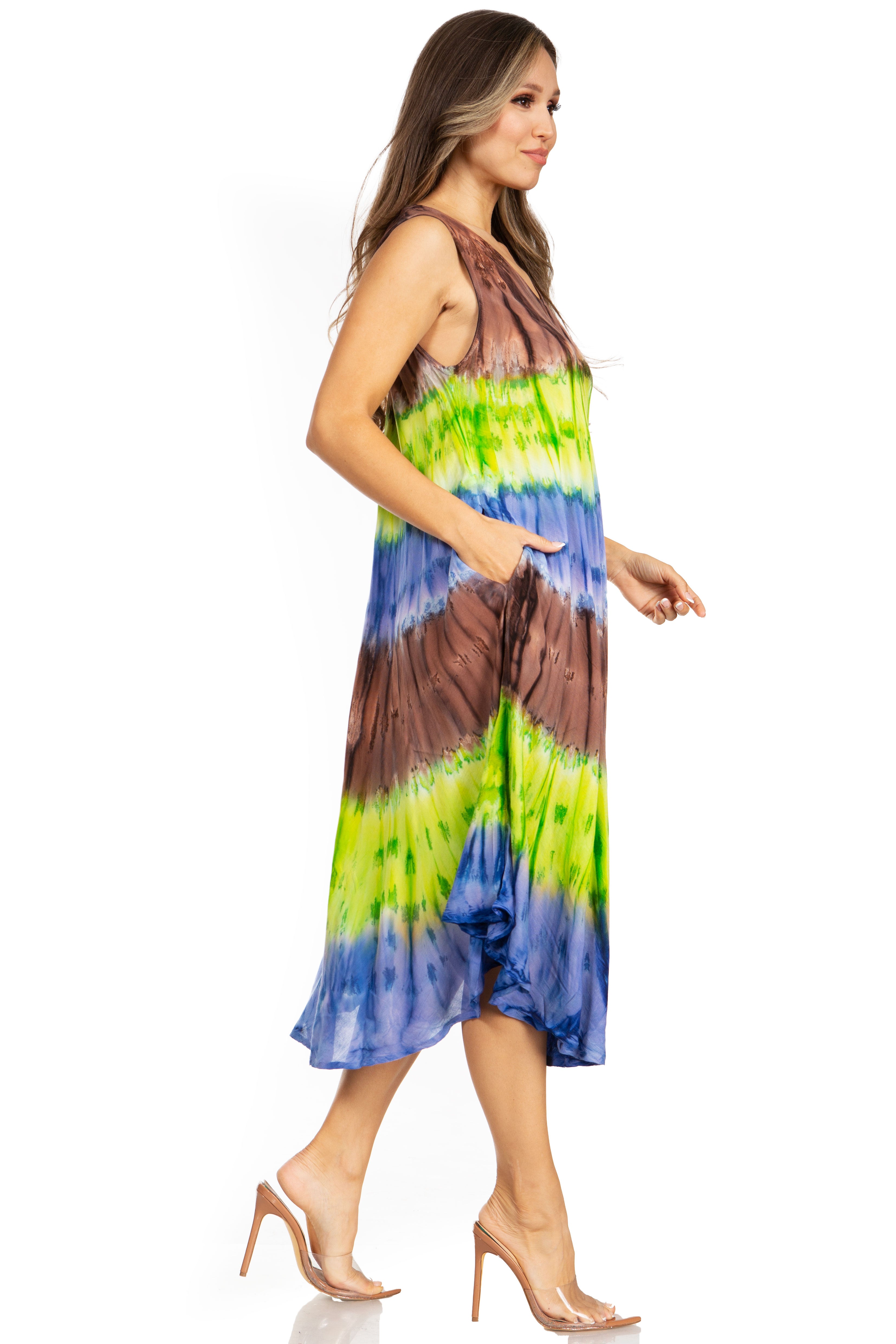 Woman wearing a tie-dye dress with brown, green, and blue colors on a white background