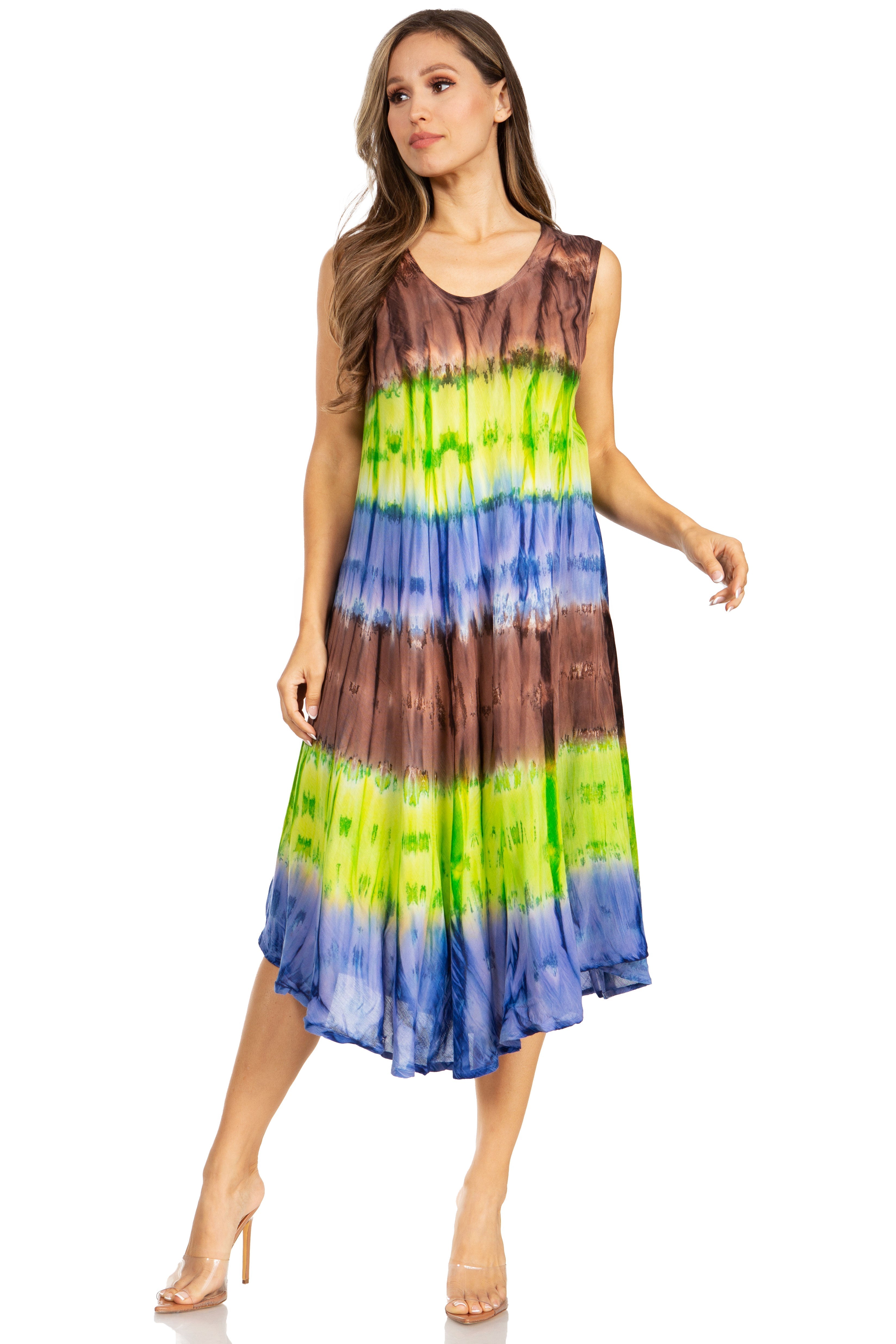Woman wearing a tie-dye dress with brown, green, and blue colors on a white background