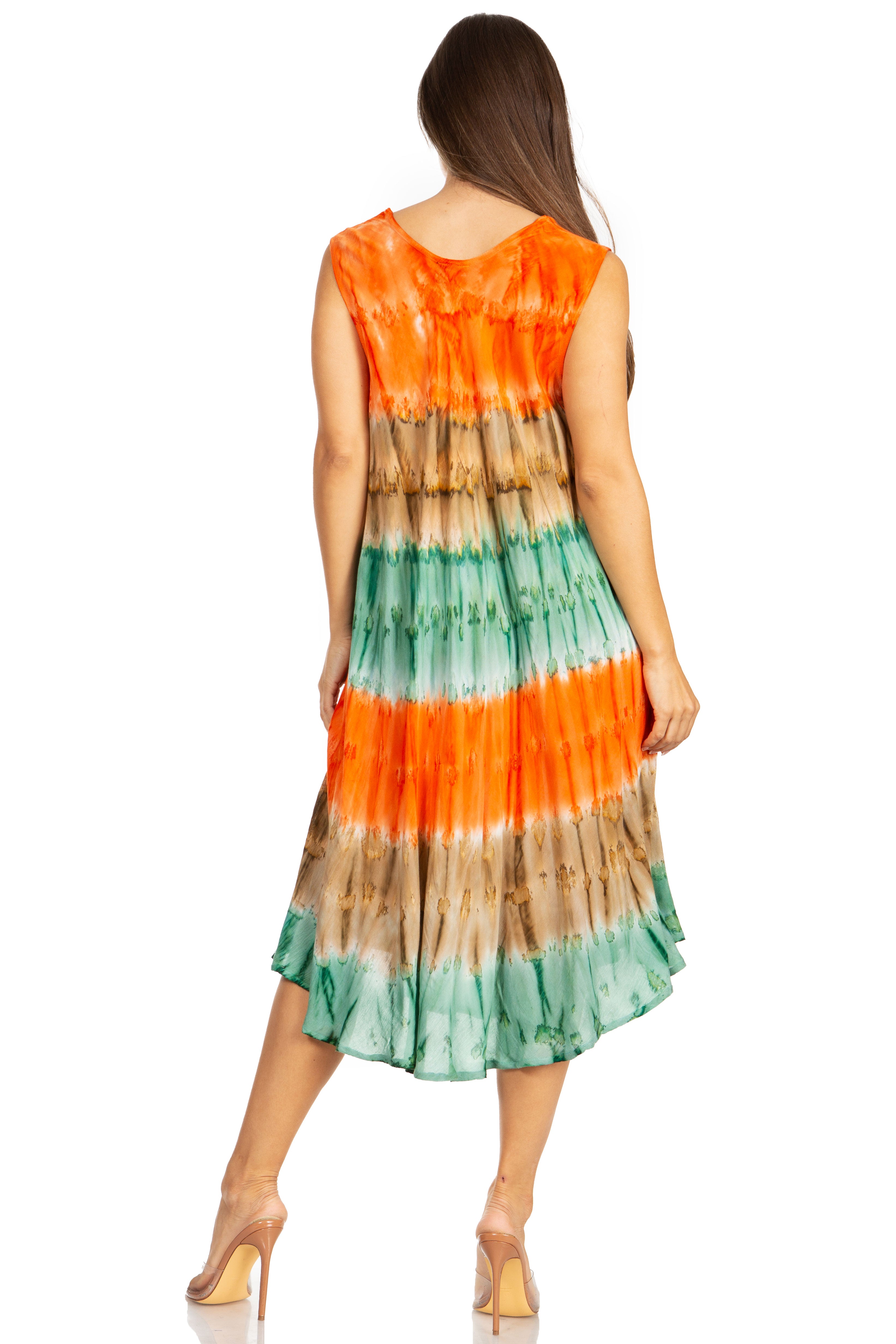 Woman wearing a tie-dye dress with orange, green, and brown colors on a white background