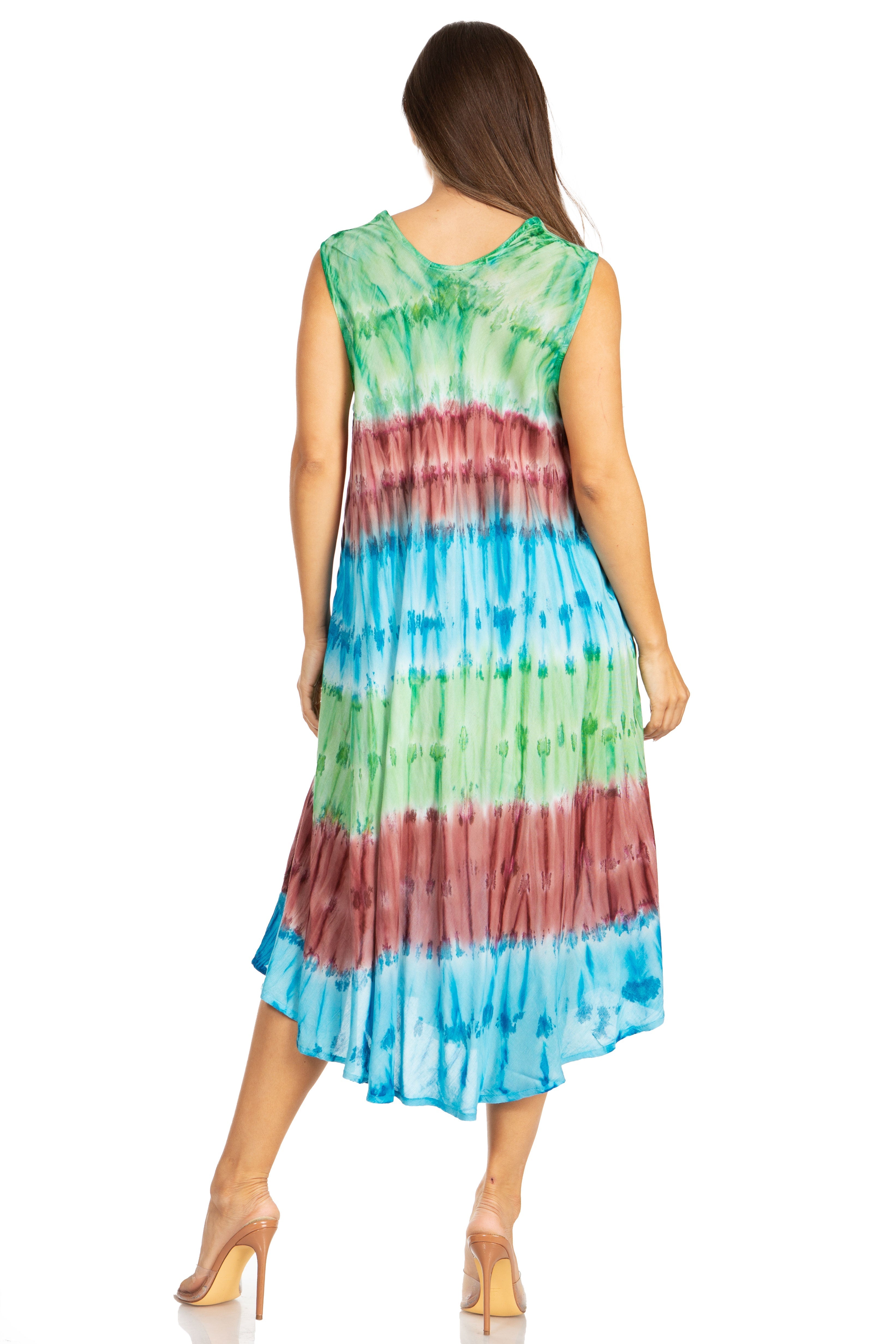 Woman wearing a tie-dye dress with green, red, and blue colors on a white background