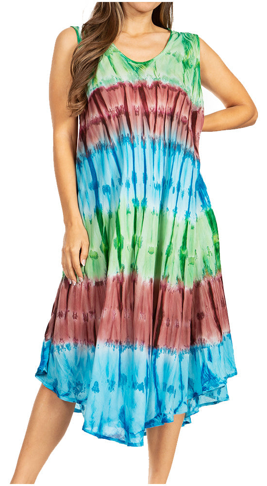 Woman wearing a tie-dye dress with a multicolor pattern on a white background
