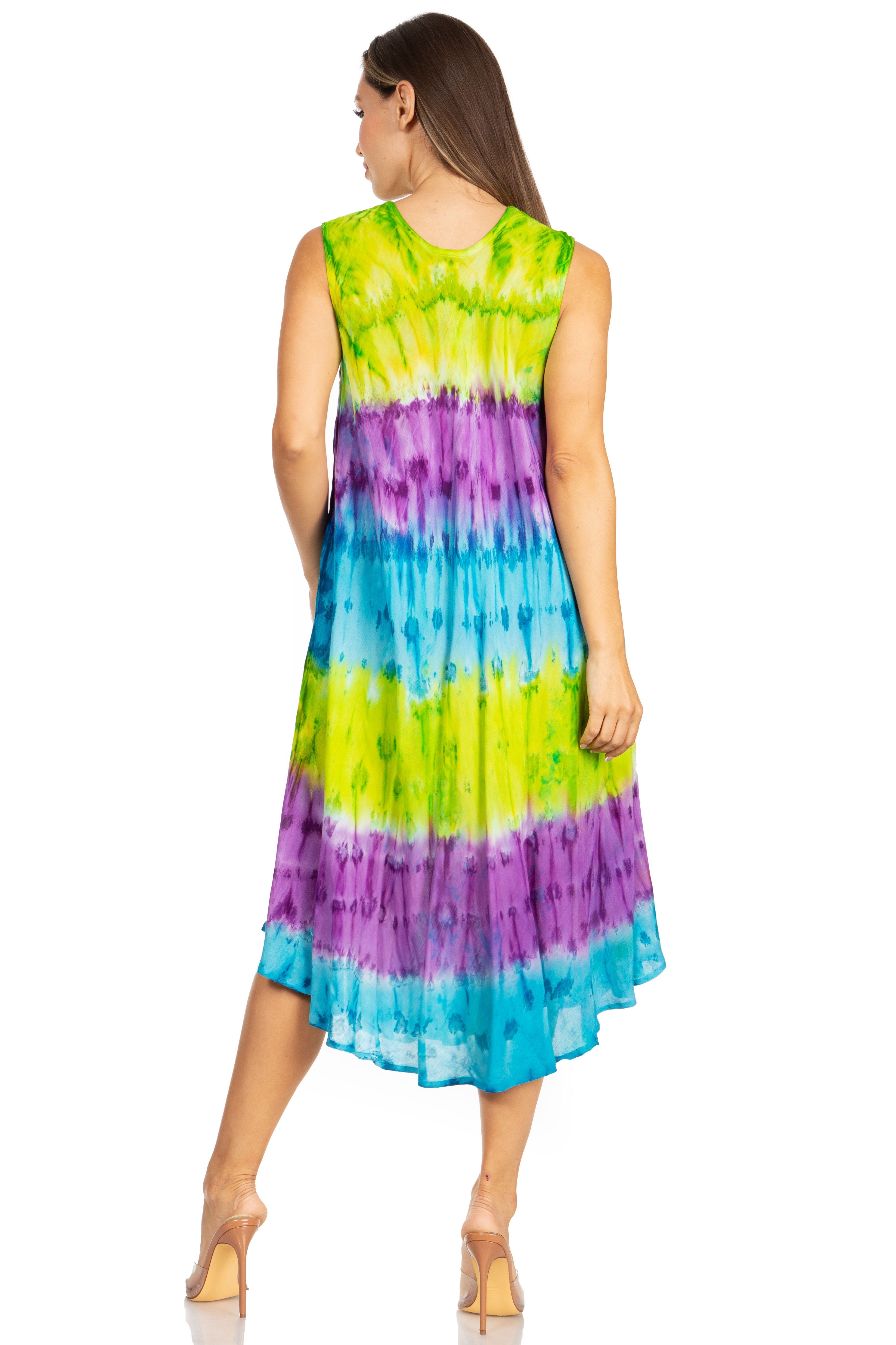 Woman wearing a tie-dye dress with green, purple, and blue colors on a white background