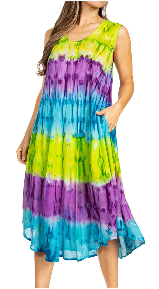 Woman wearing a tie-dye dress with green, purple, and blue colors on a white background