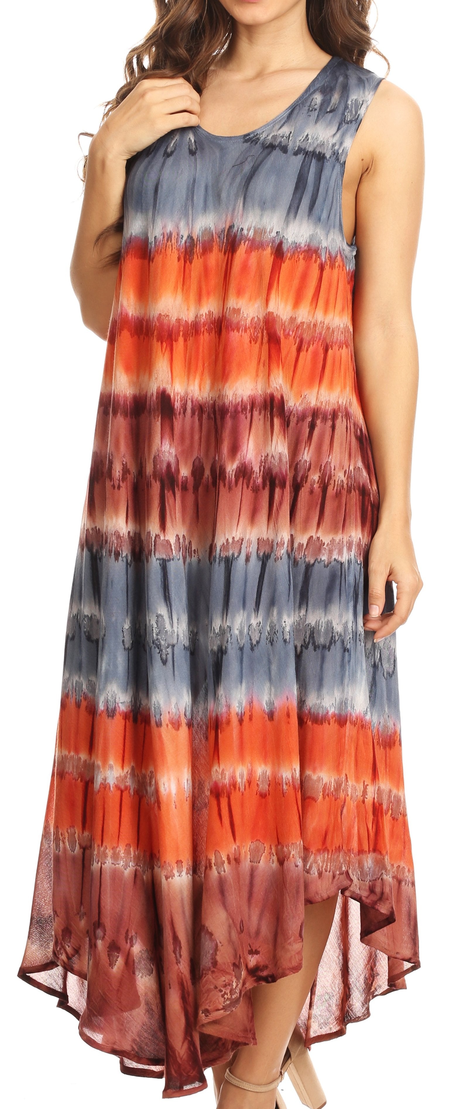 Woman wearing a sleeveless dress with red, orange, and blue tie-dye pattern.