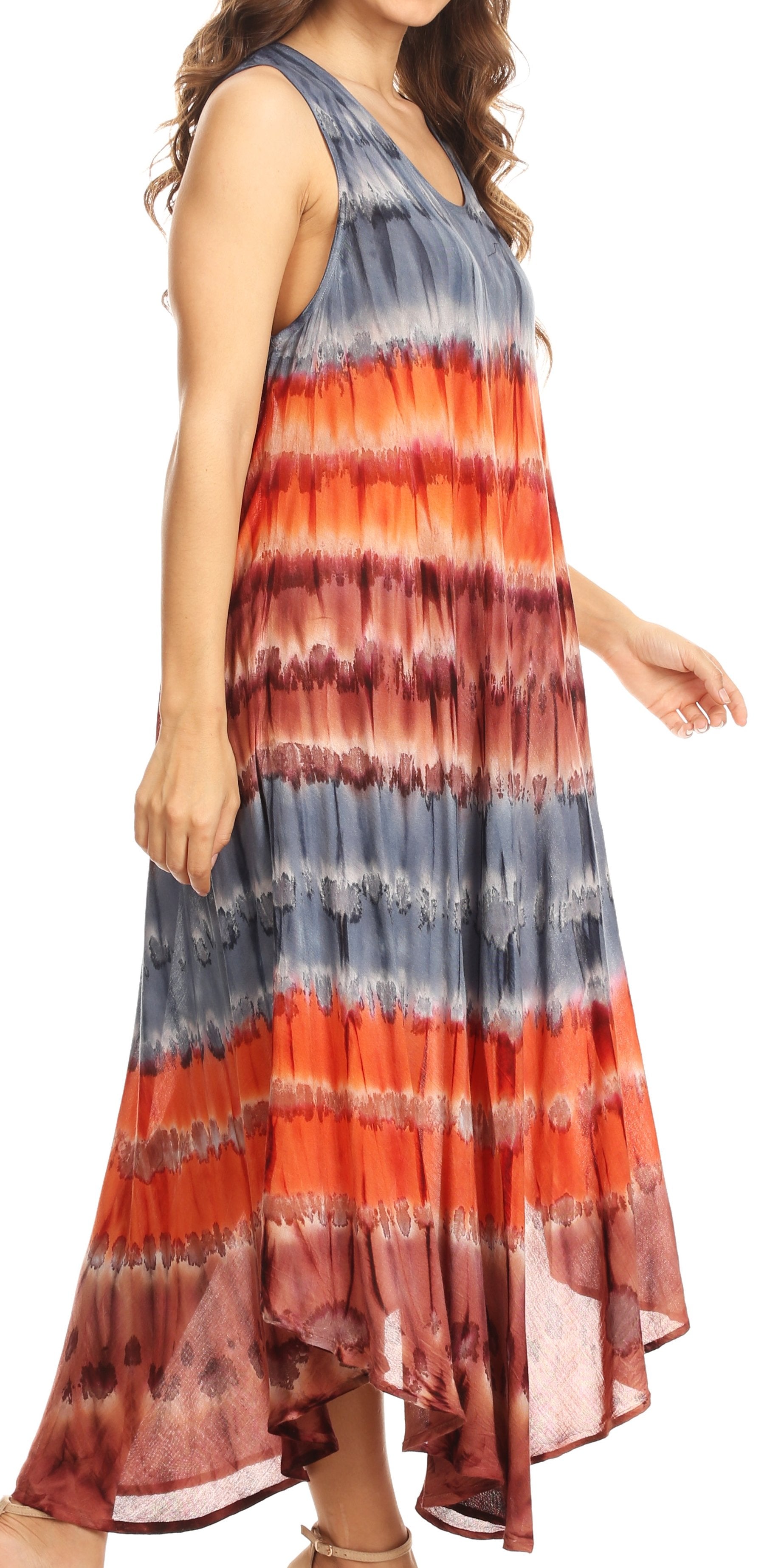 Woman wearing a tie-dye dress with red, orange, and blue stripes on a white background