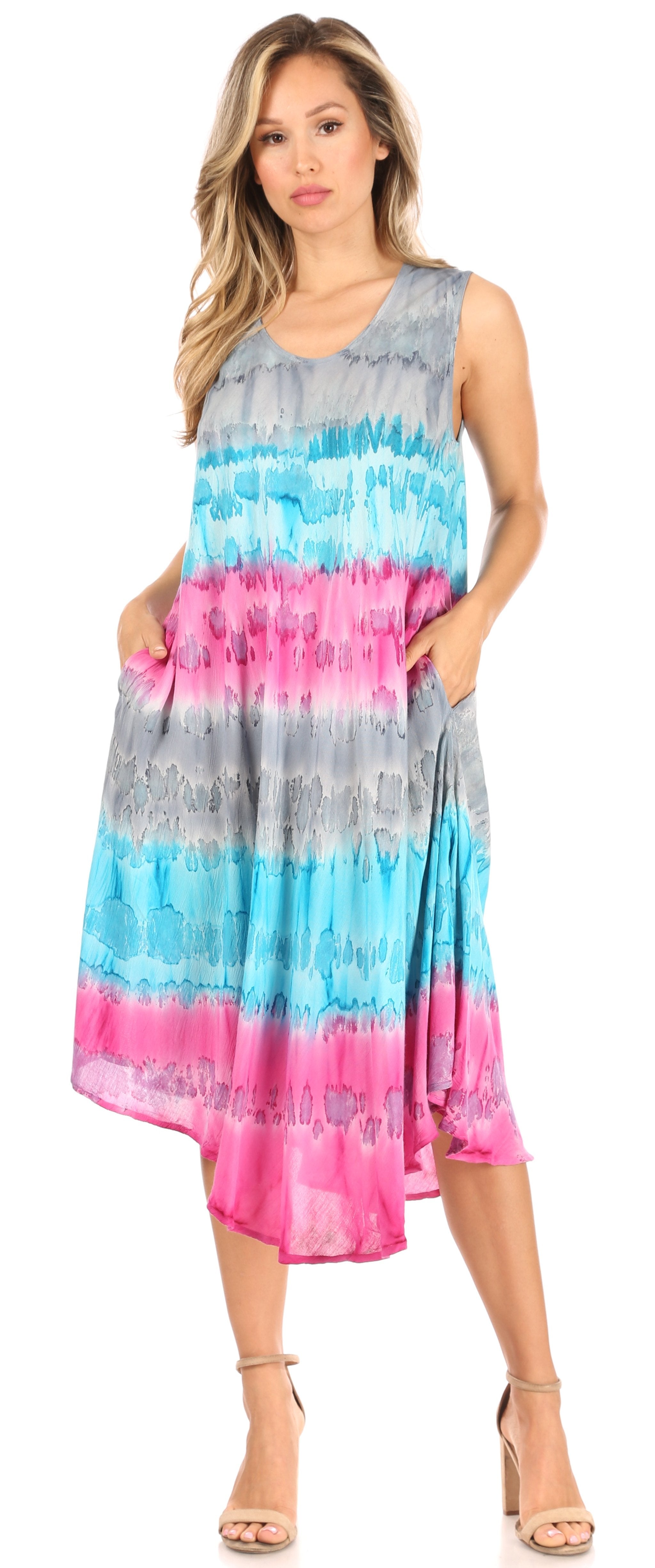 Woman wearing a tie-dye dress with blue, pink, and gray colors on a white background