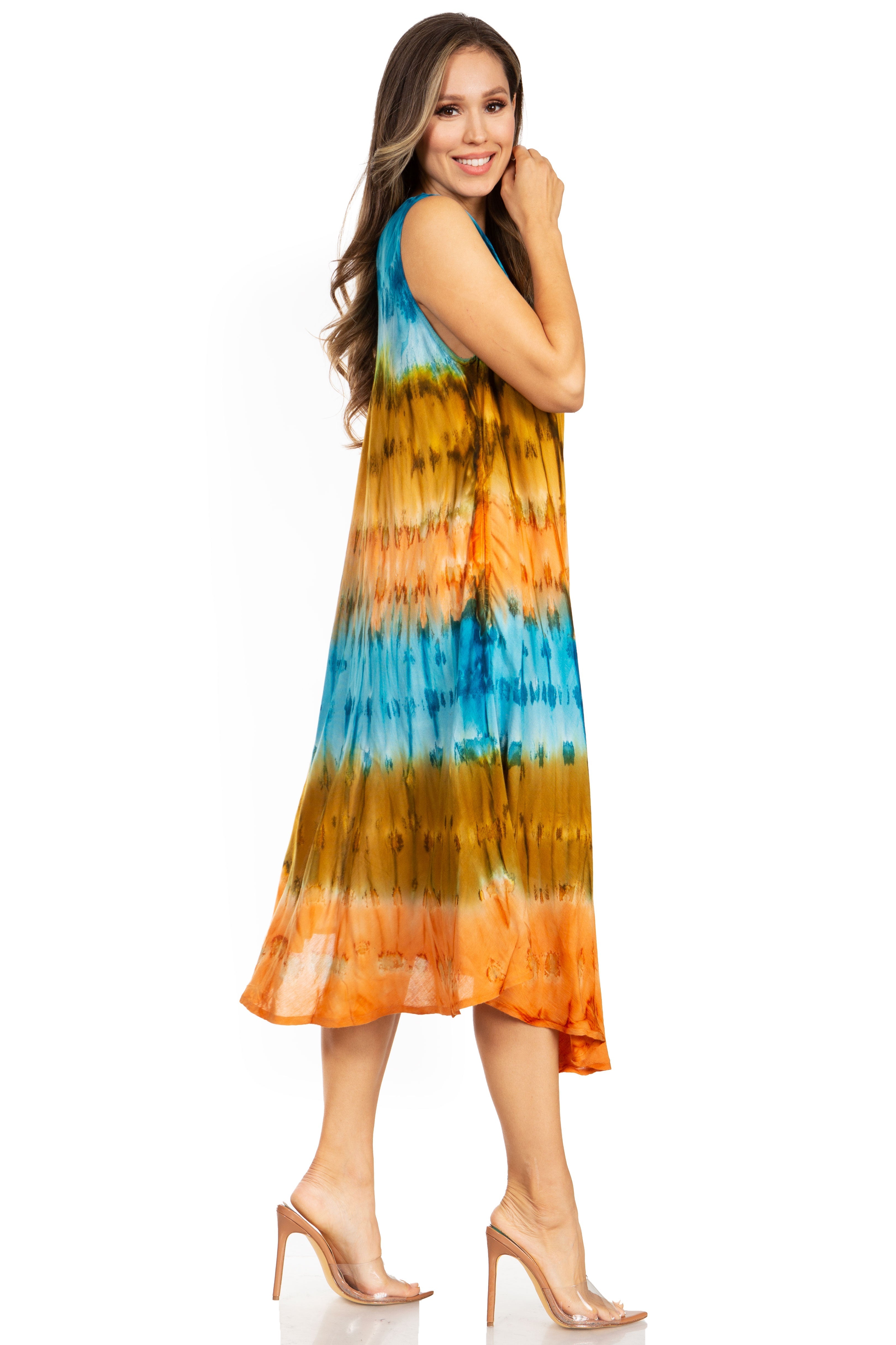 Woman wearing a tie-dye dress with orange and blue patterns on a white background