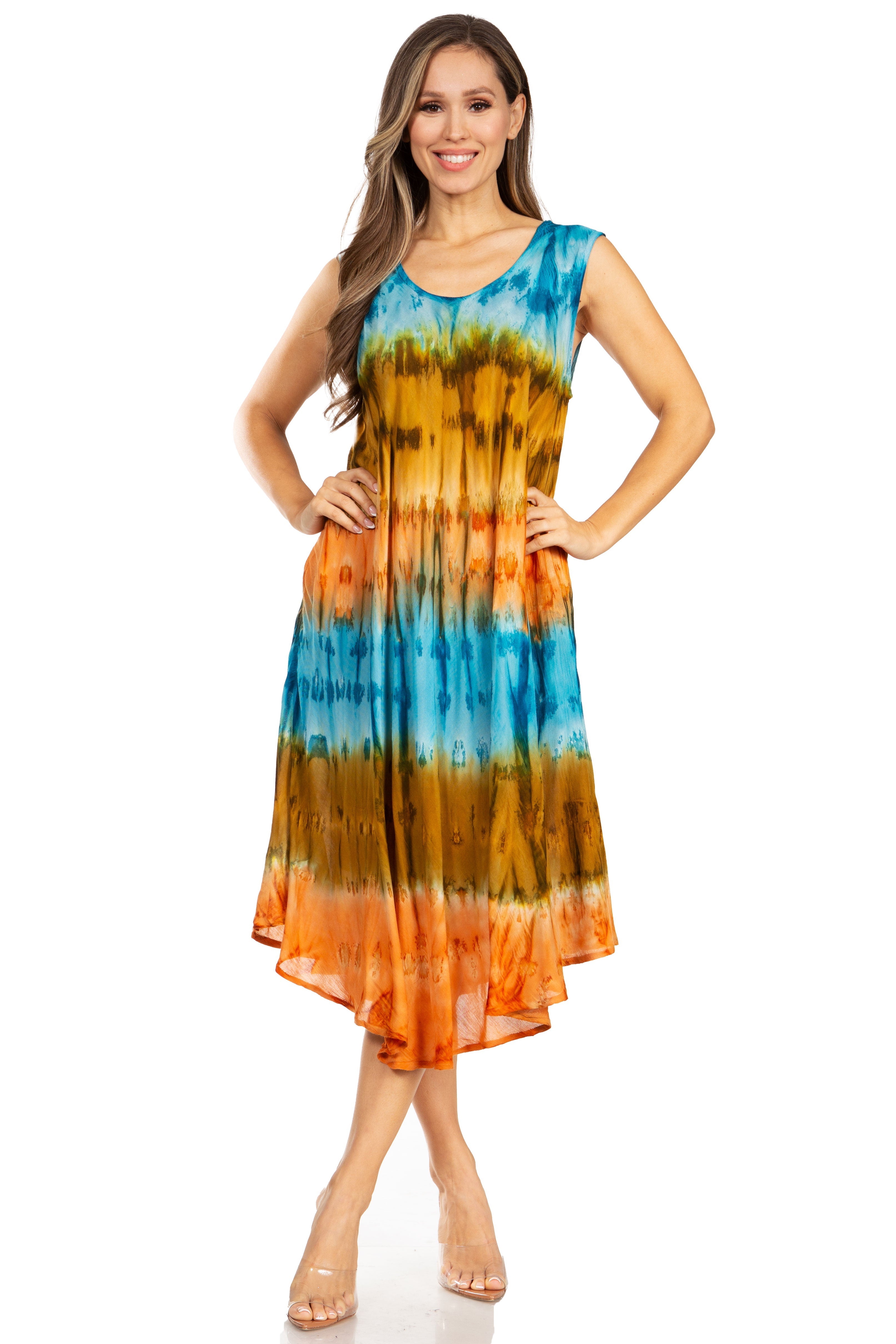 Woman wearing a tie-dye dress with orange, yellow, and blue pattern on a white background