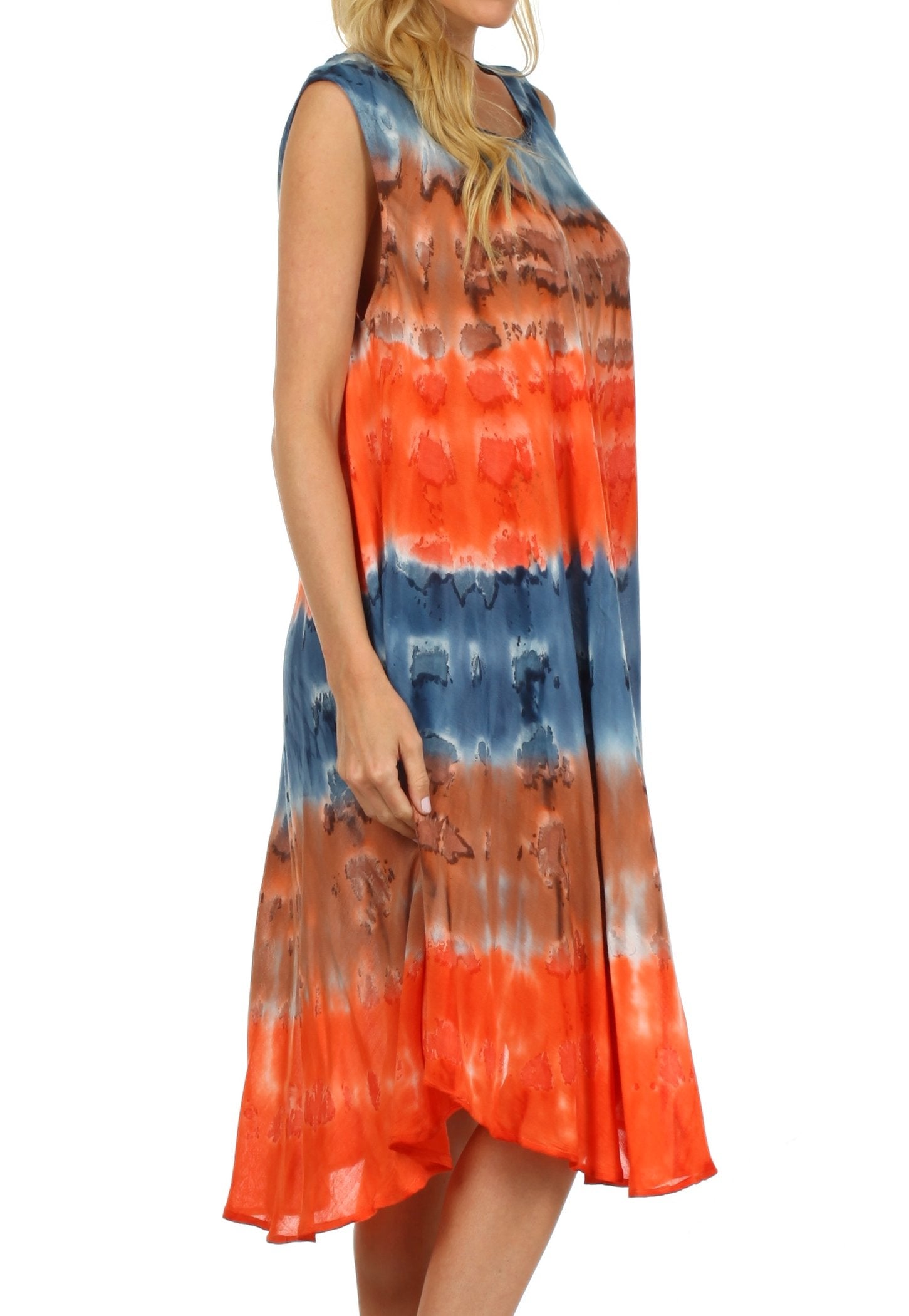 Woman wearing a tie-dye dress with orange, blue, and white pattern on a white background