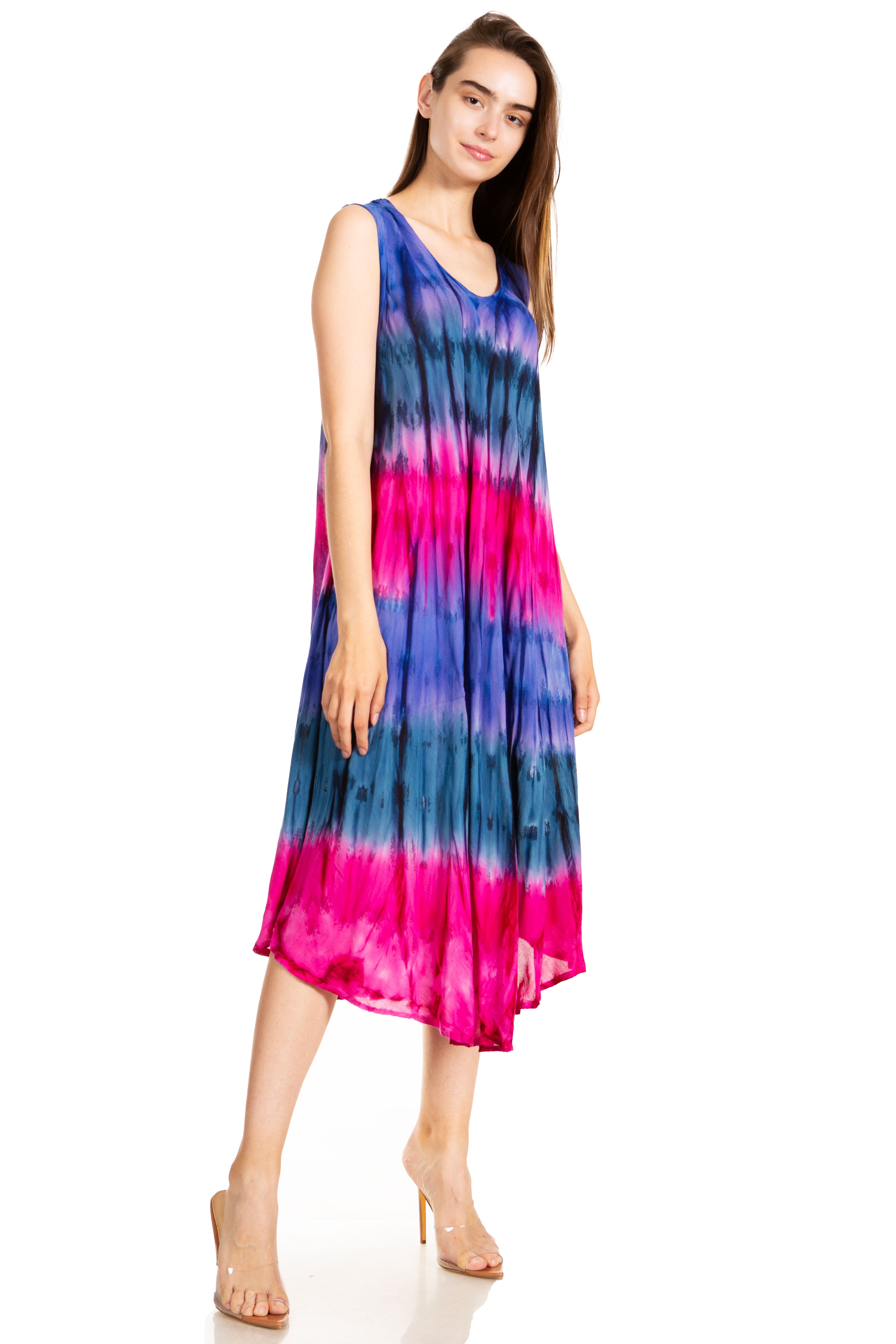 Woman wearing a colorful tie-dye dress on a white background