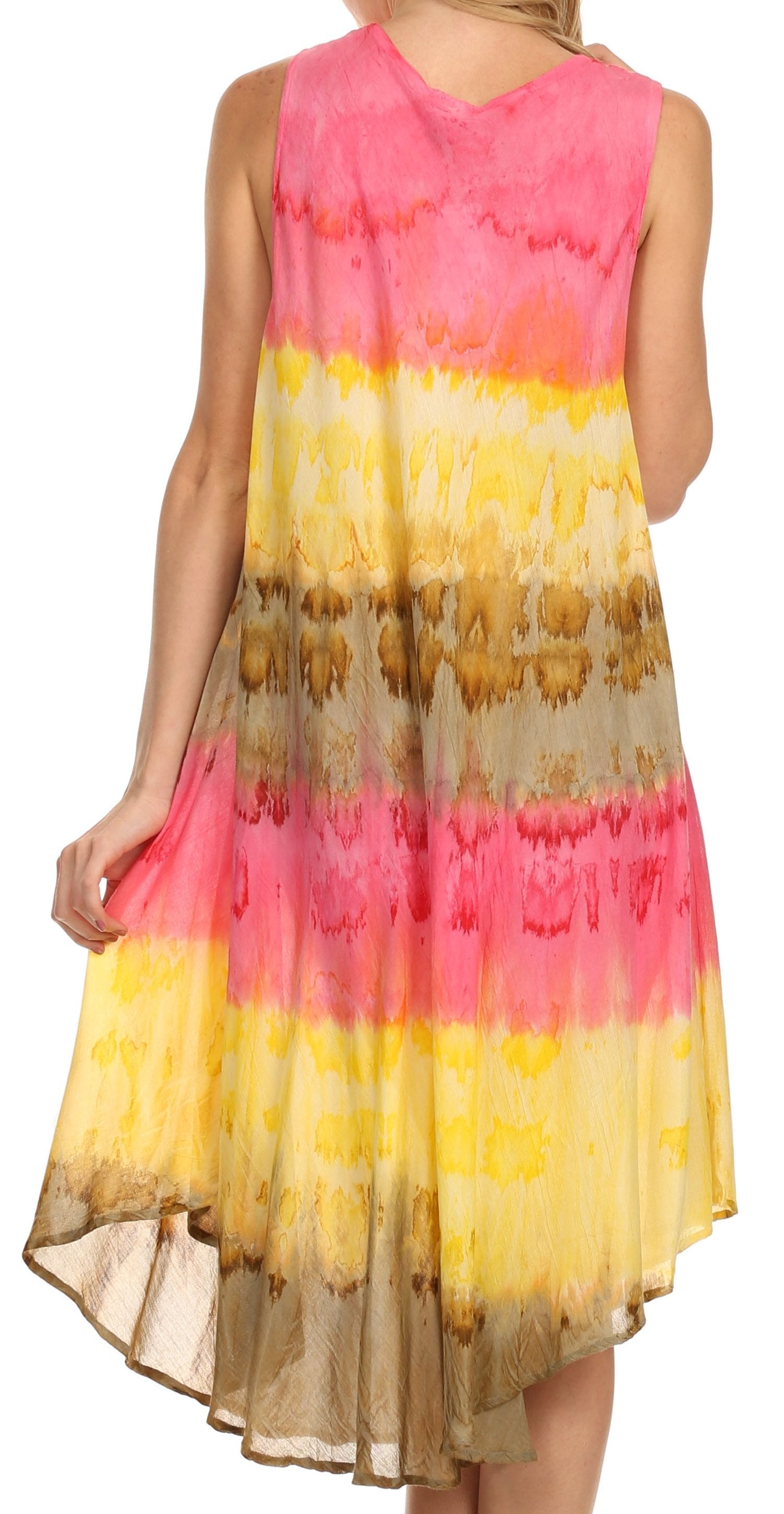 Woman wearing a sleeveless dress with a colorful, gradient pattern on a white background