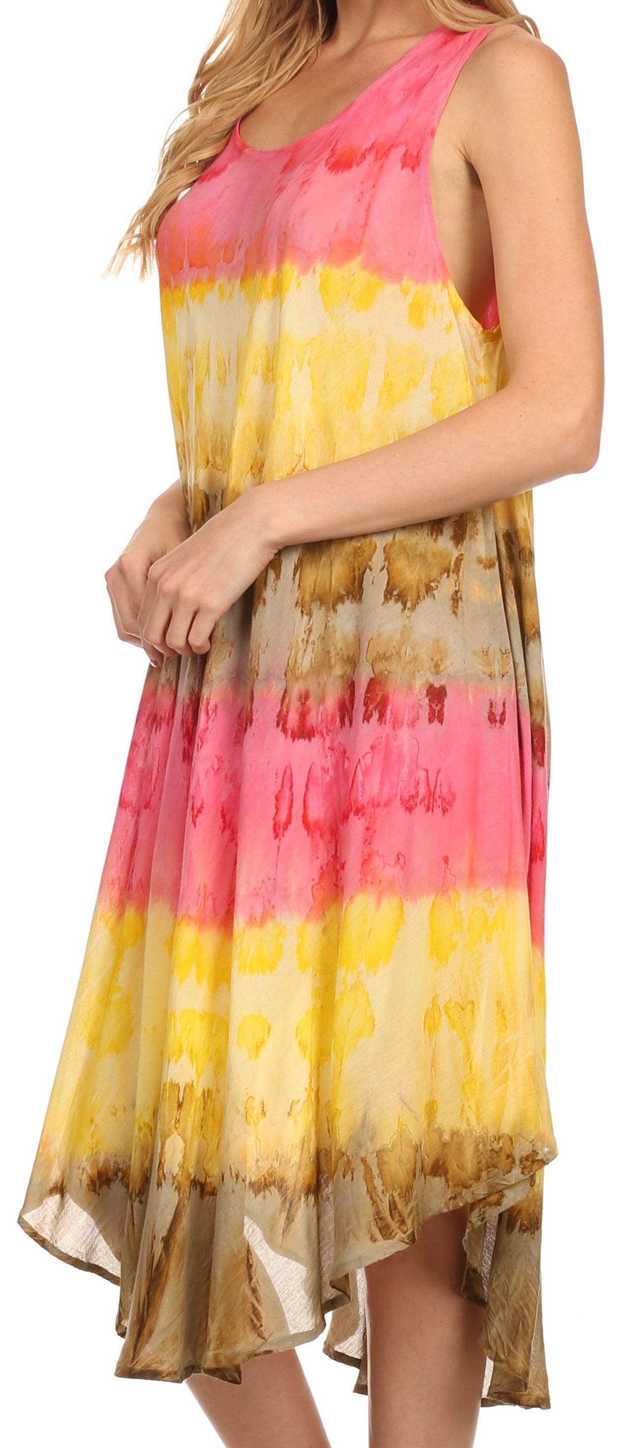 Woman wearing a tie-dye dress with pink, yellow, and brown colors on a white background