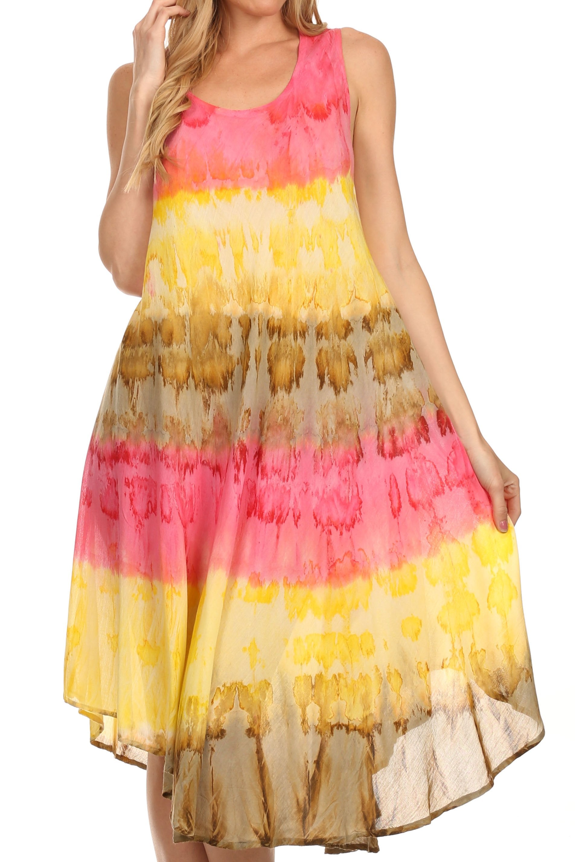 Woman wearing a tie-dye dress with pink, yellow, and beige colors on a white background.