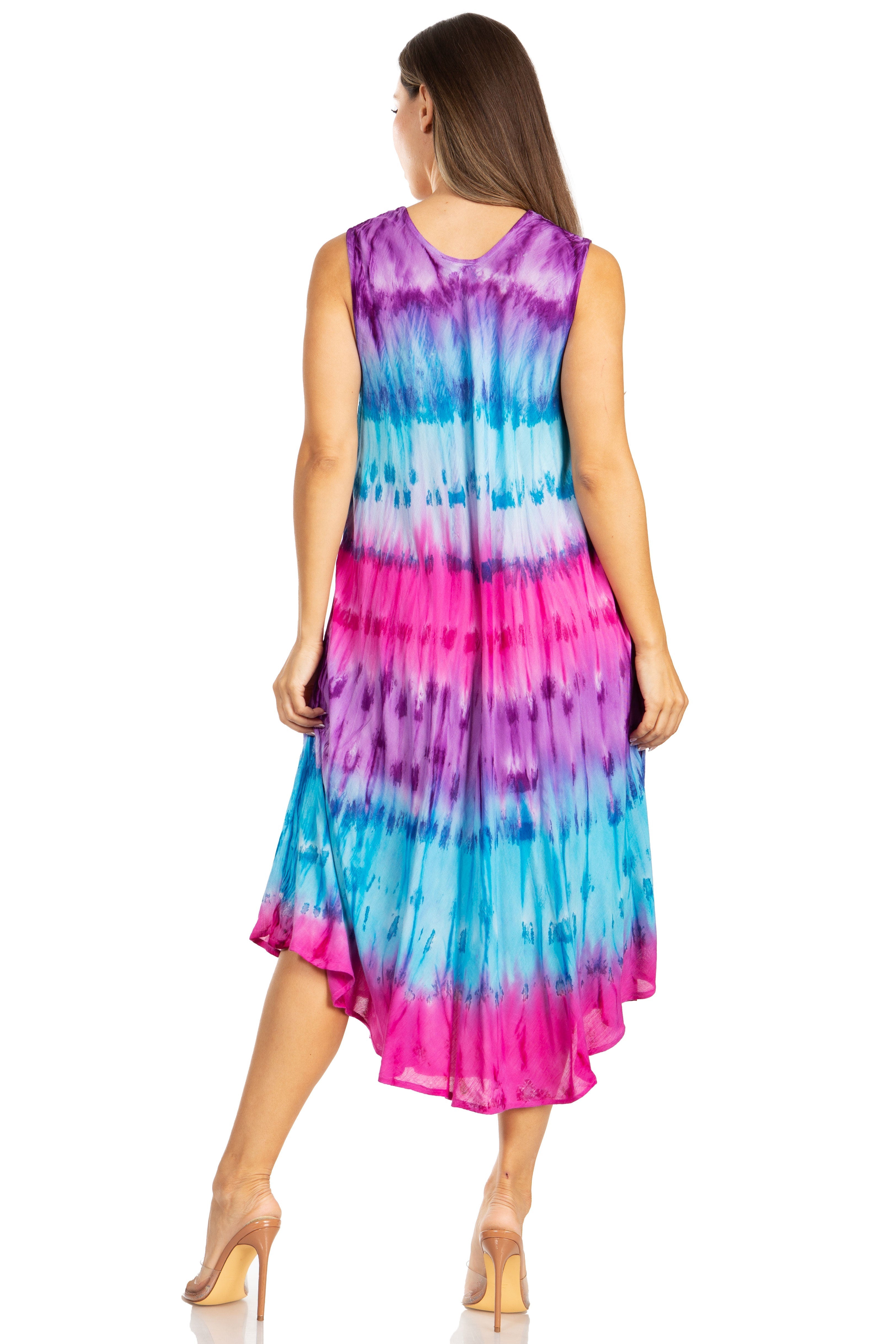 Woman wearing a tie-dye dress with pink and blue patterns on a white background