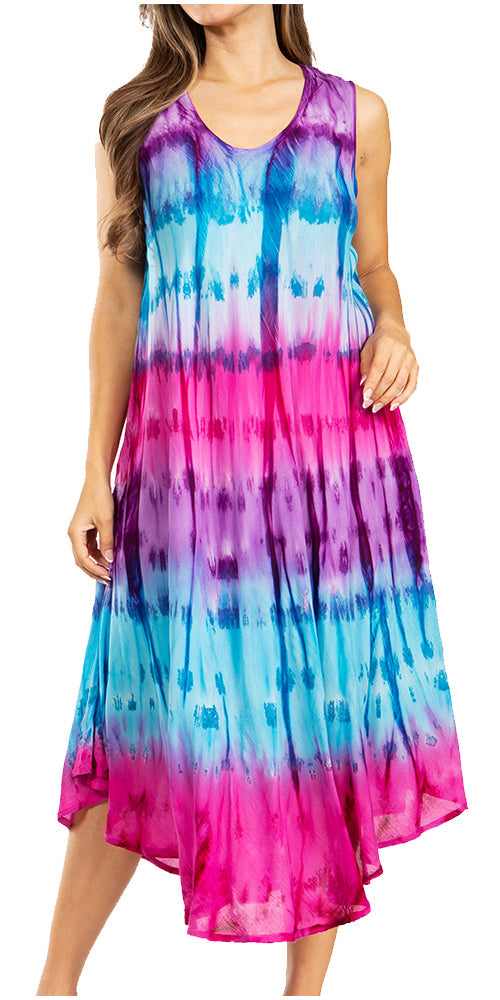 Woman wearing a tie-dye dress with a gradient of pink, blue, and purple on a white background.