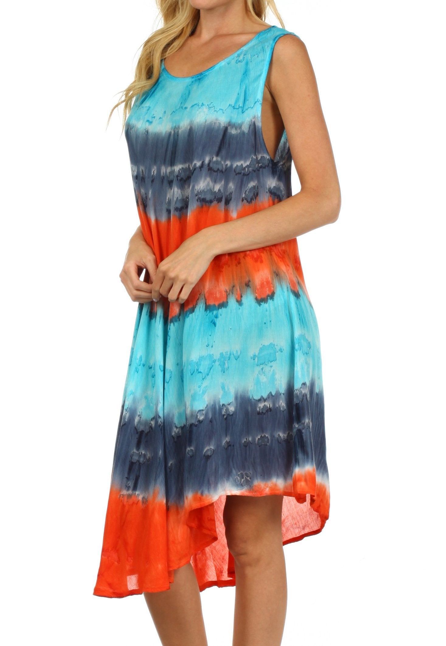 Woman wearing a tie-dye dress with blue, orange, and white colors on a white background.