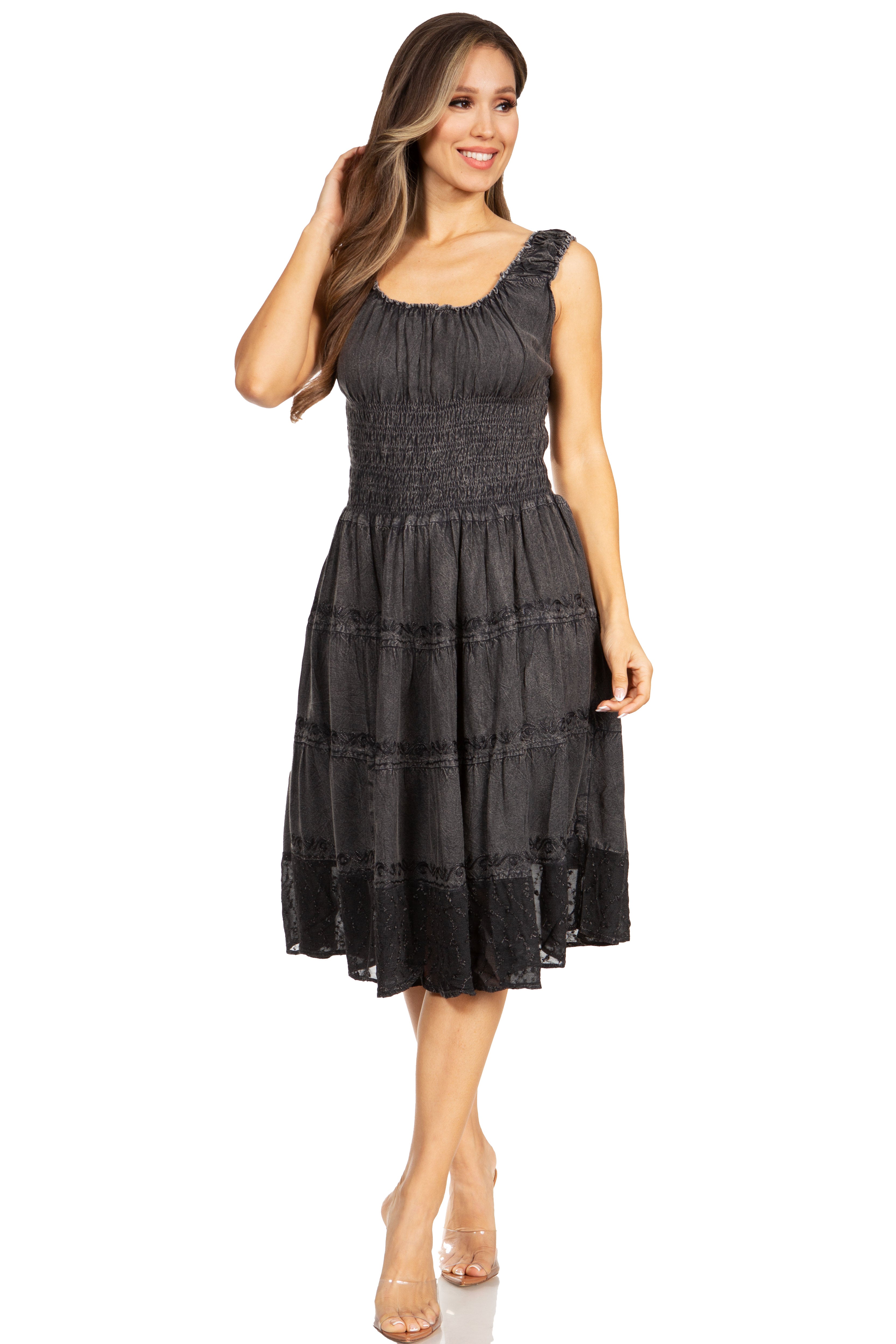 Woman wearing a black patterned dress on a white background