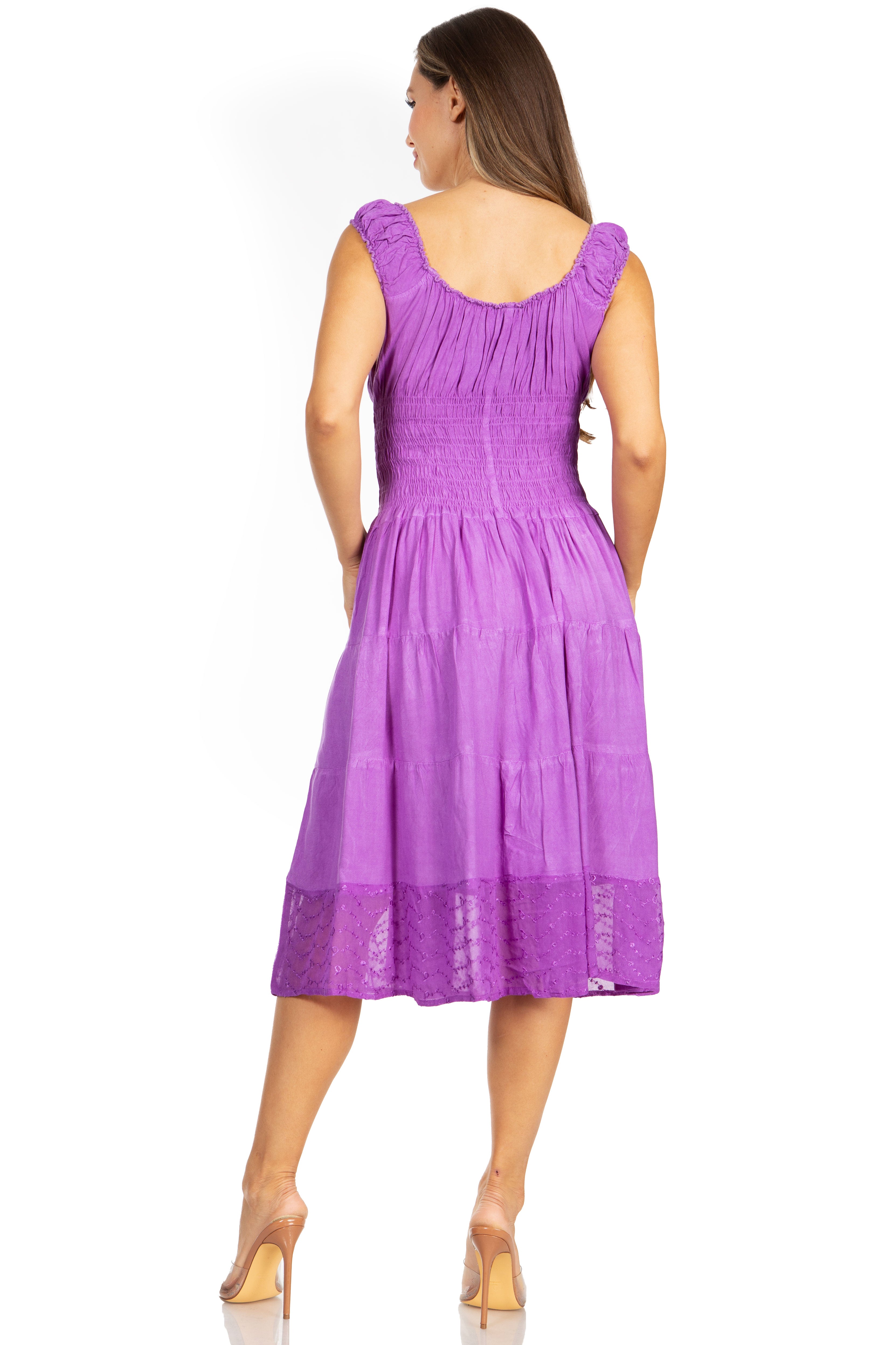 Woman wearing a purple dress on a white background