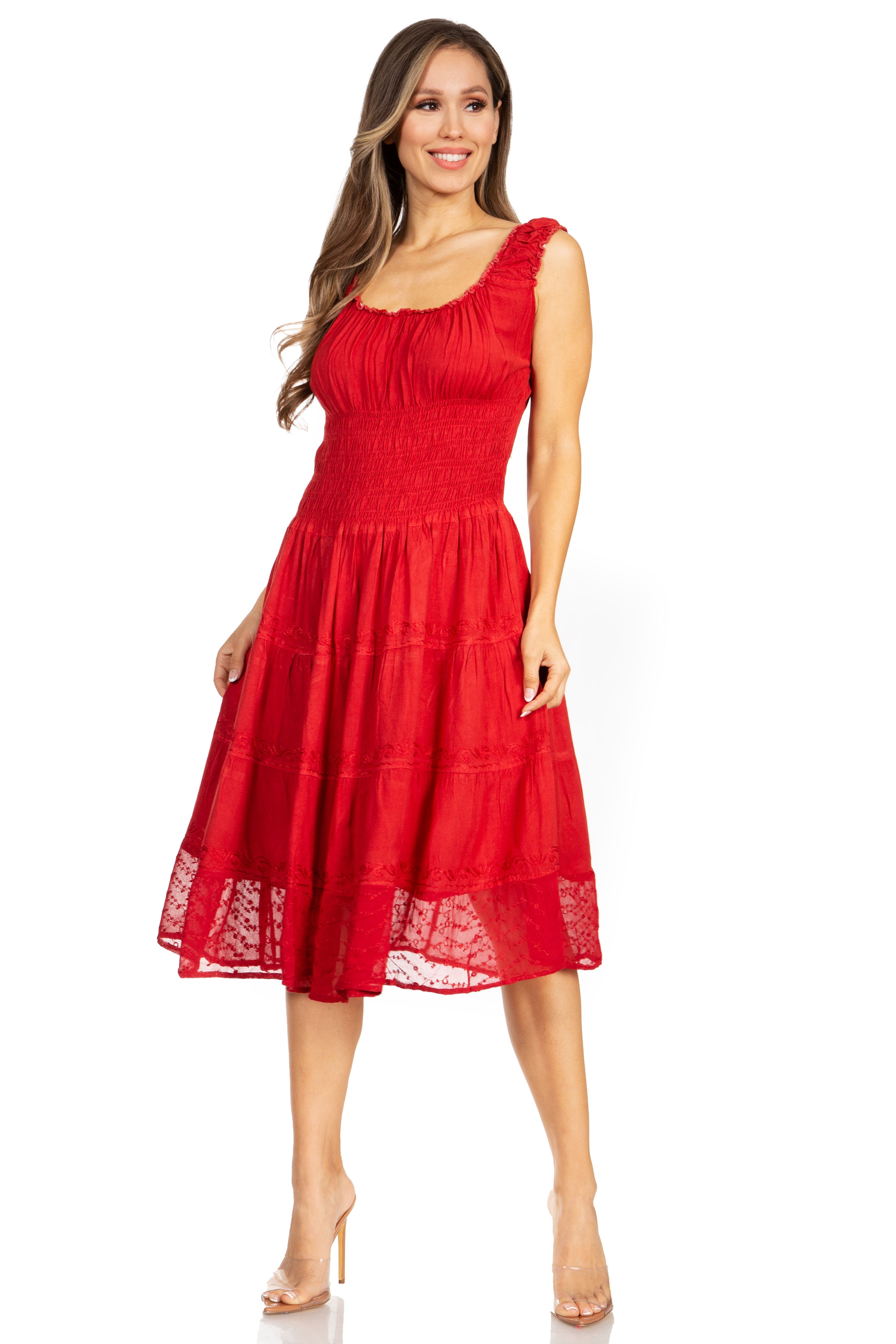 Woman wearing a red dress with lace details on a white background