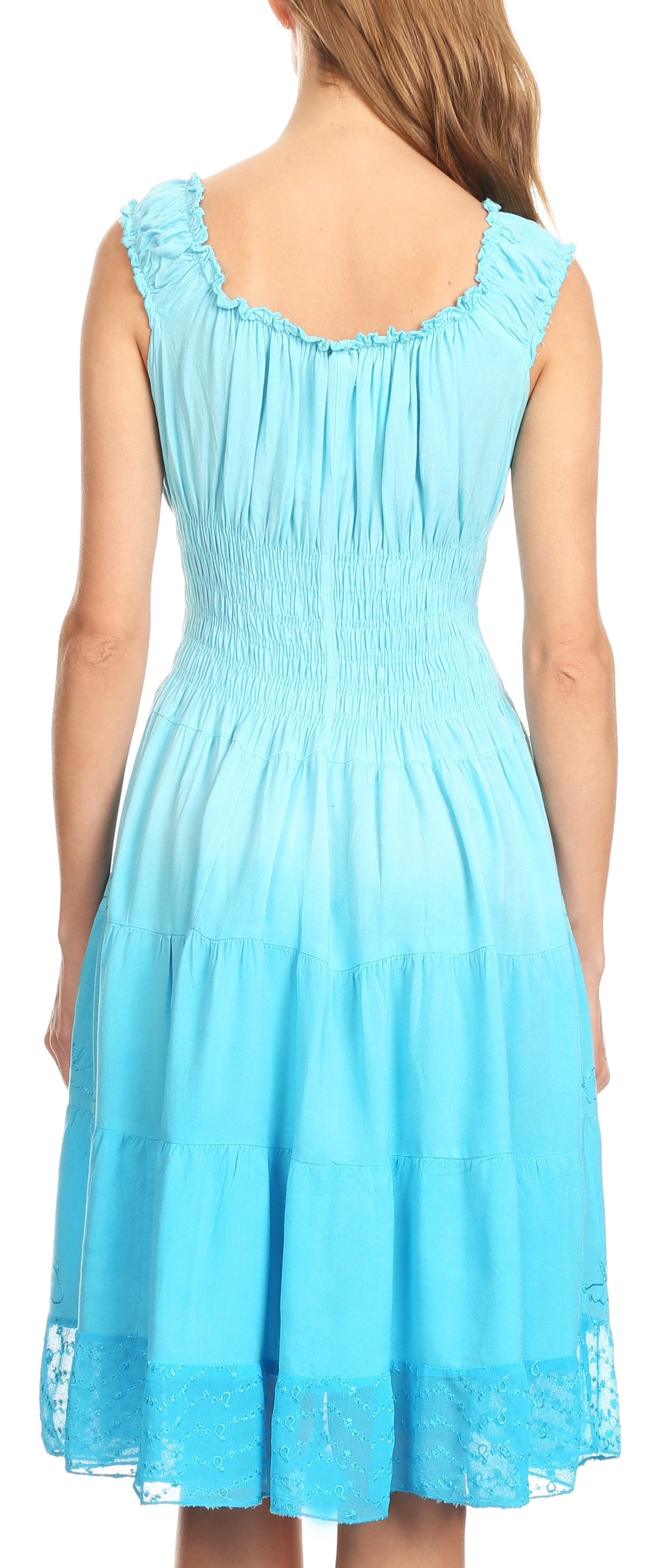 Woman wearing a light blue dress with lace details