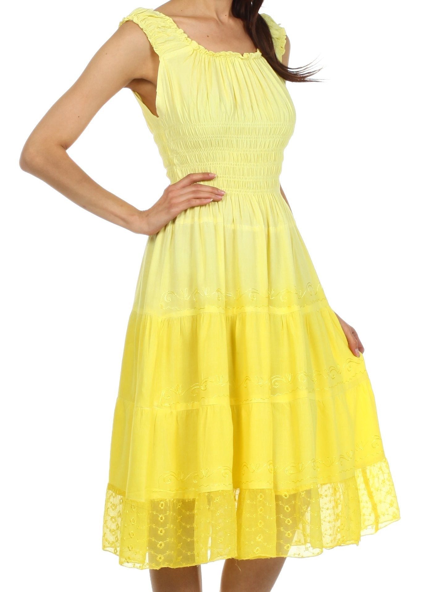 Yellow dress with lace details on a white background