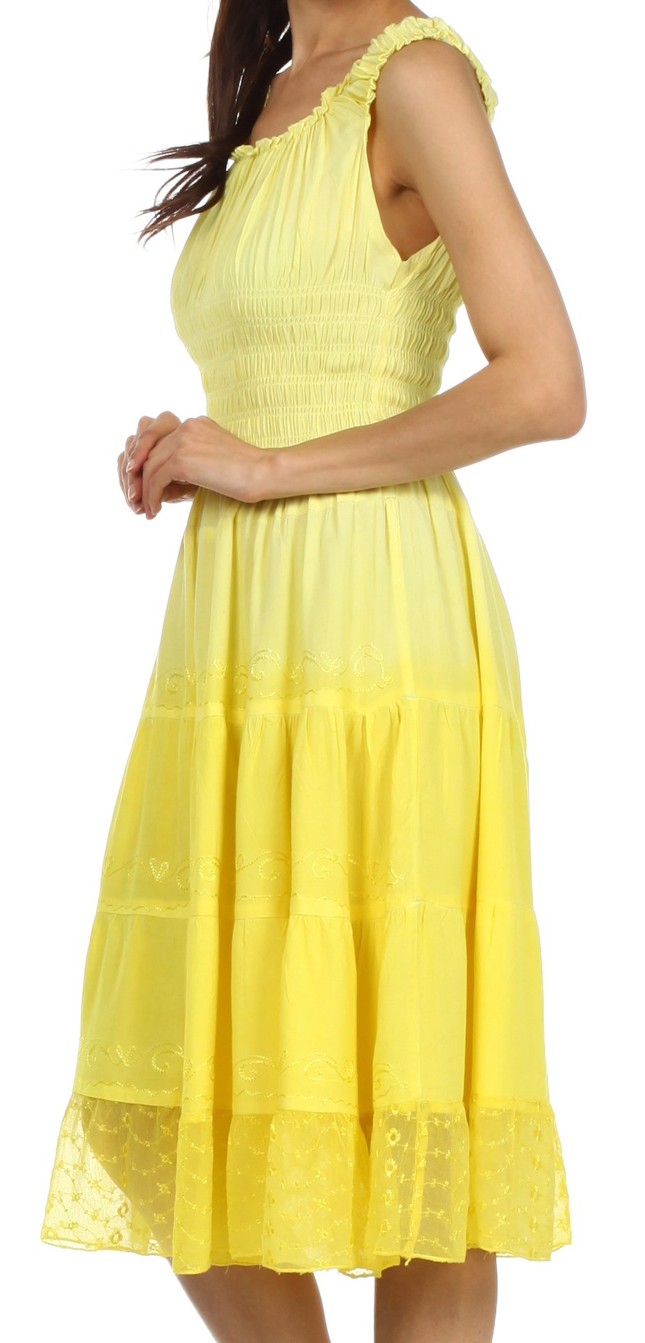 Yellow dress with lace details on a white background
