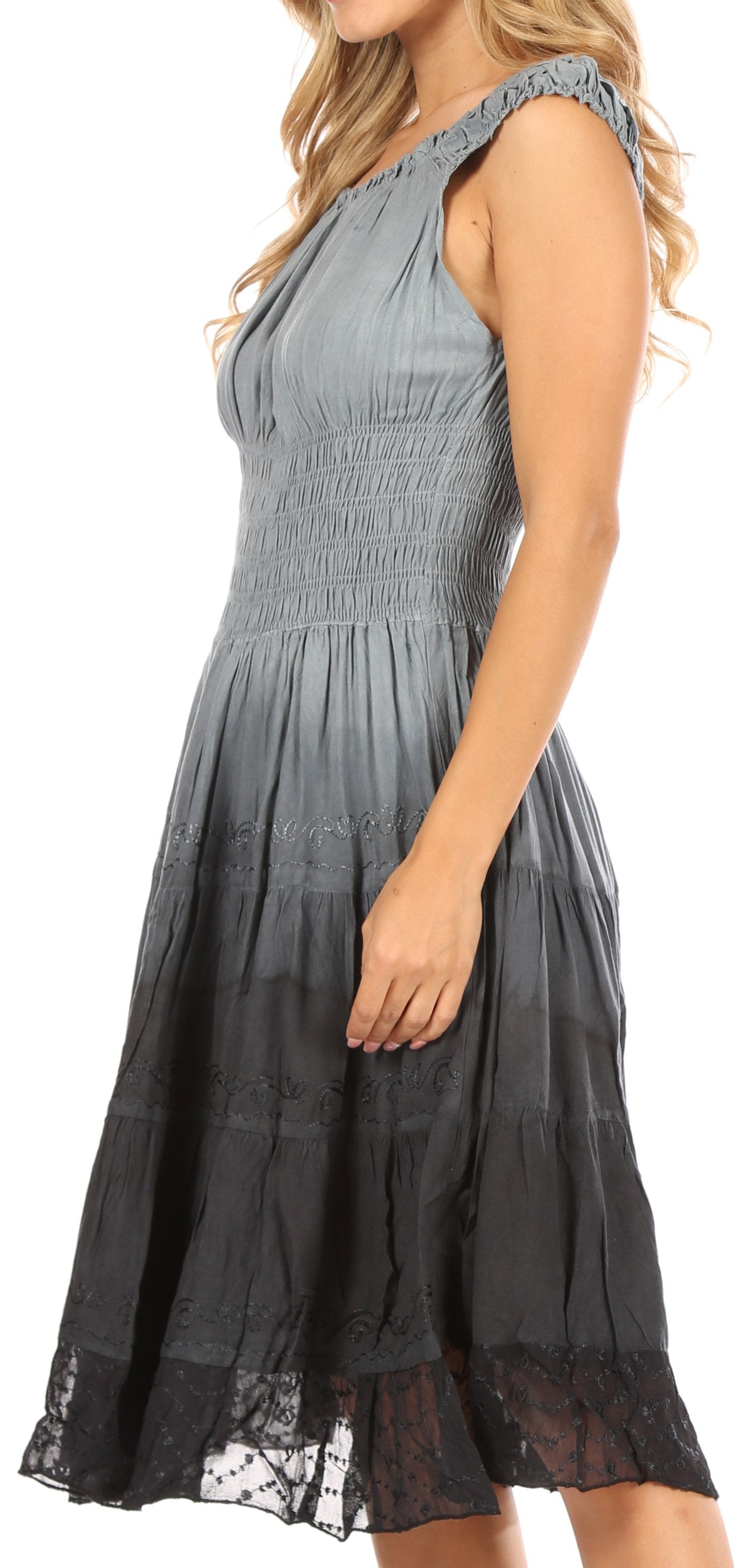 Woman wearing a gray dress with lace details on a white background