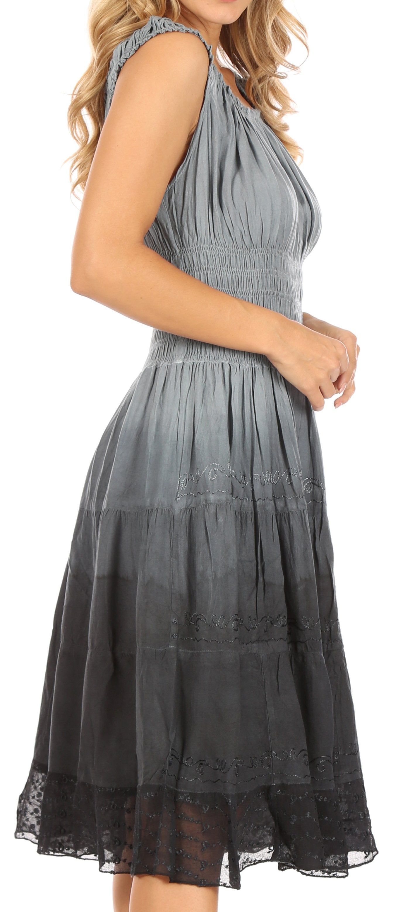 Woman wearing a gray halter neck dress with black lace trim.