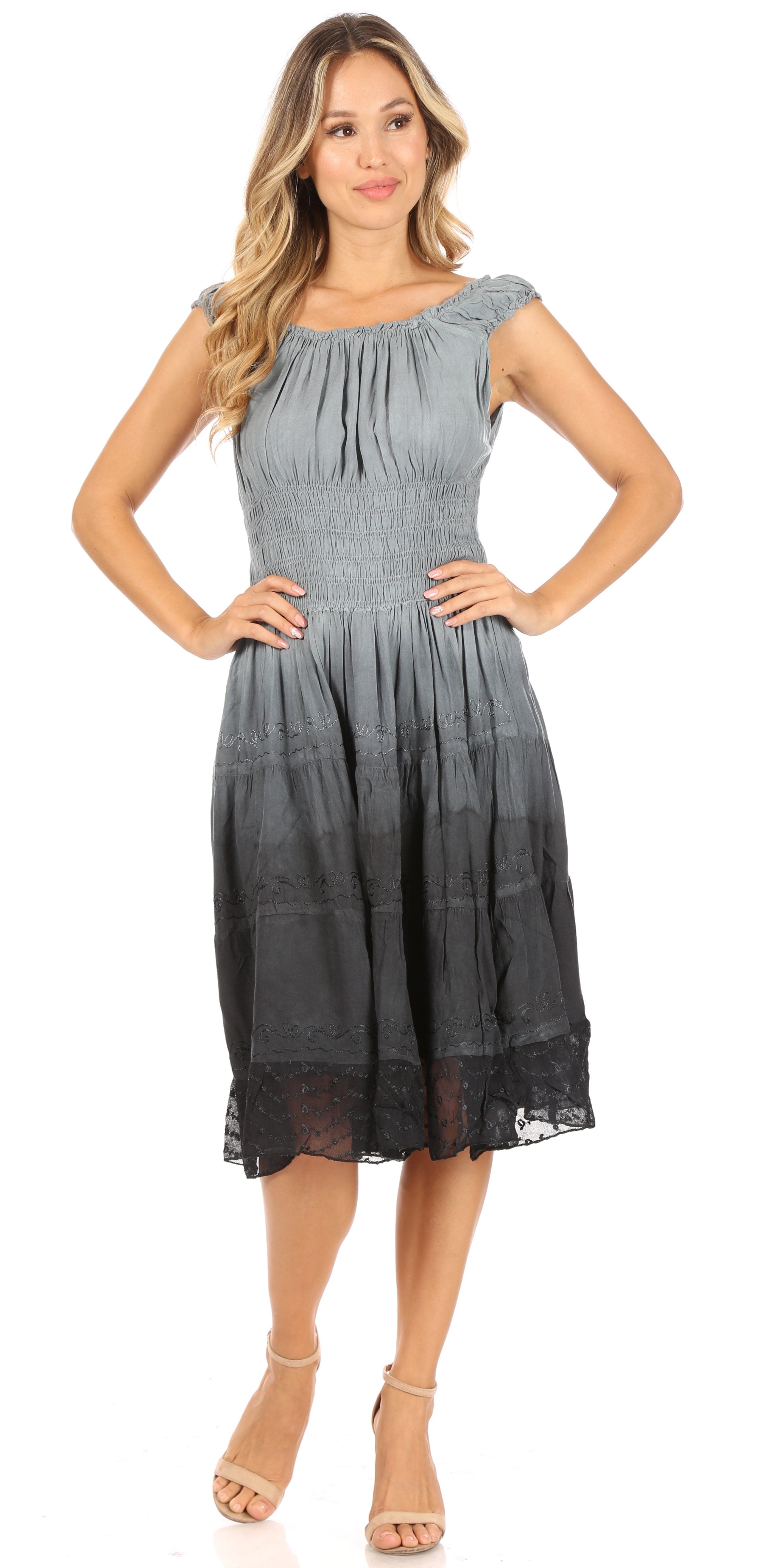 Woman wearing a gray sleeveless dress on a white background