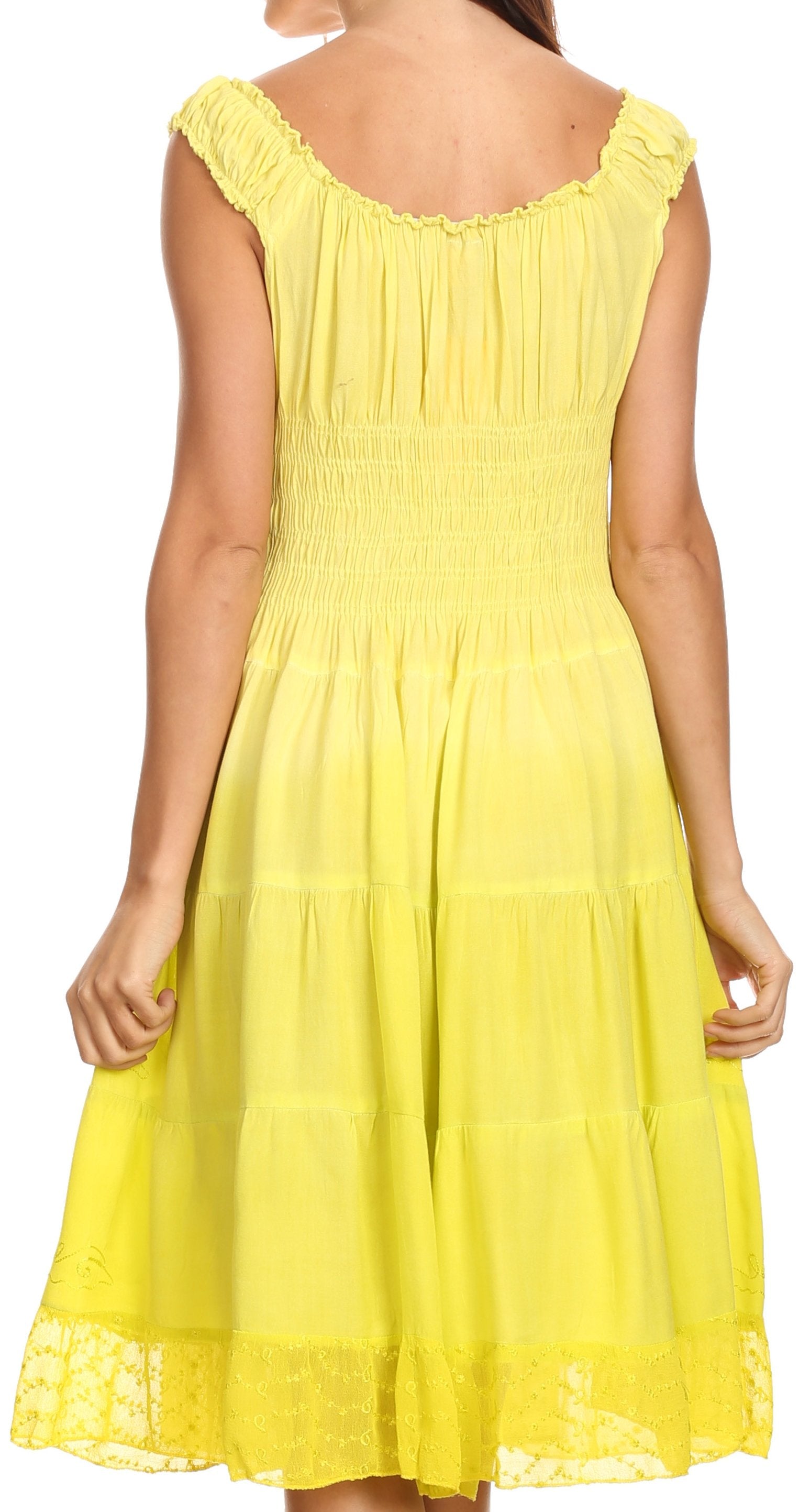 Yellow dress with lace details on a white background