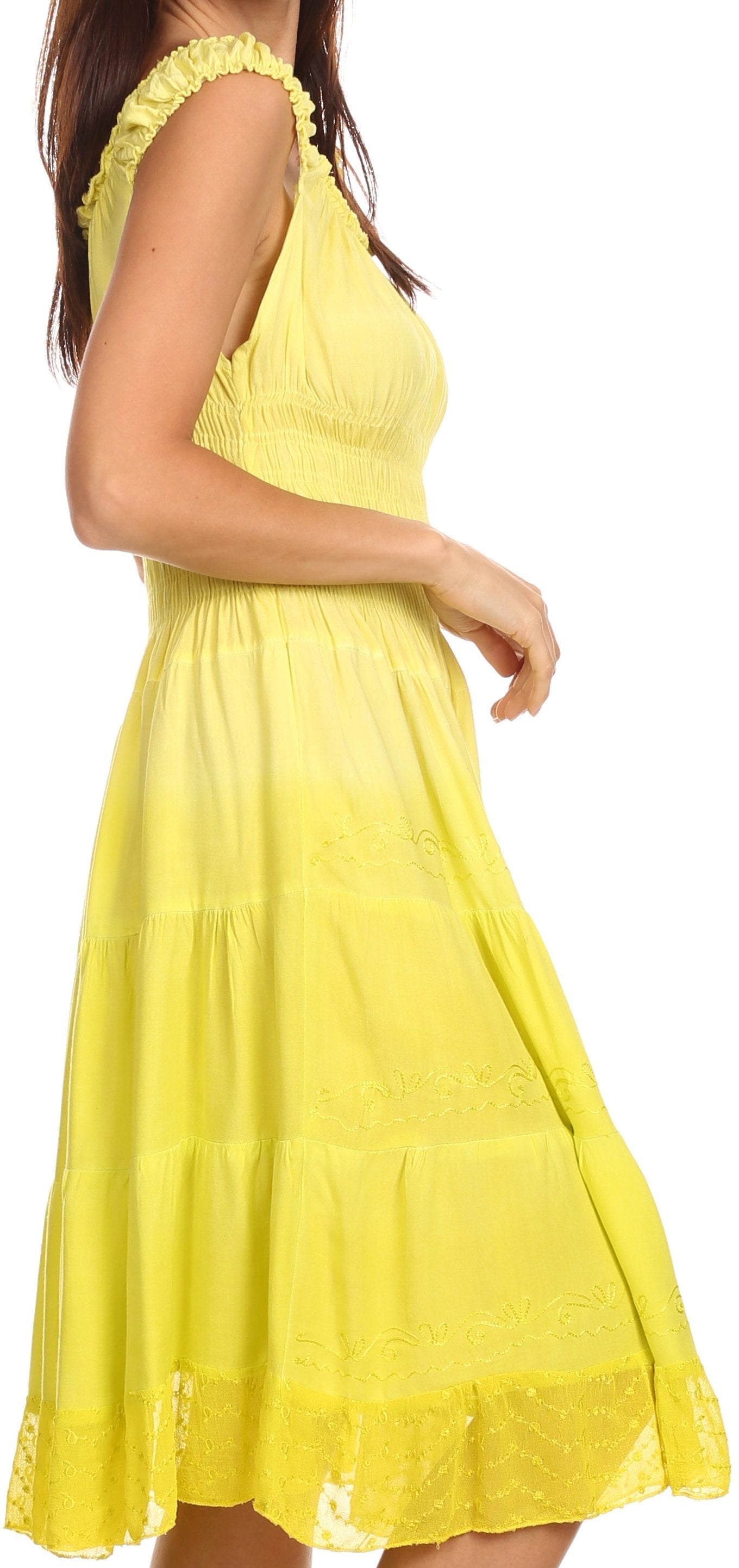 Yellow dress with ruffled details on a white background