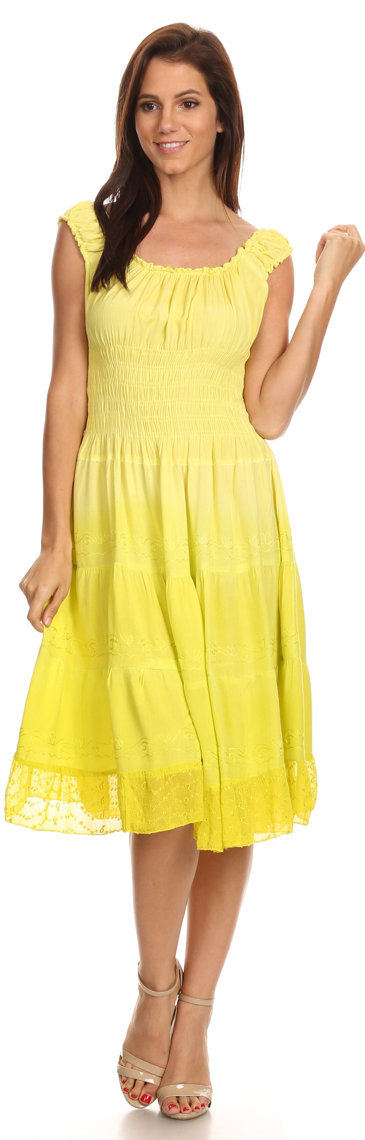 Woman wearing a yellow dress on a white background