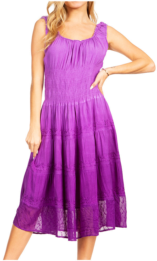 Woman wearing a purple dress with lace details on a white background