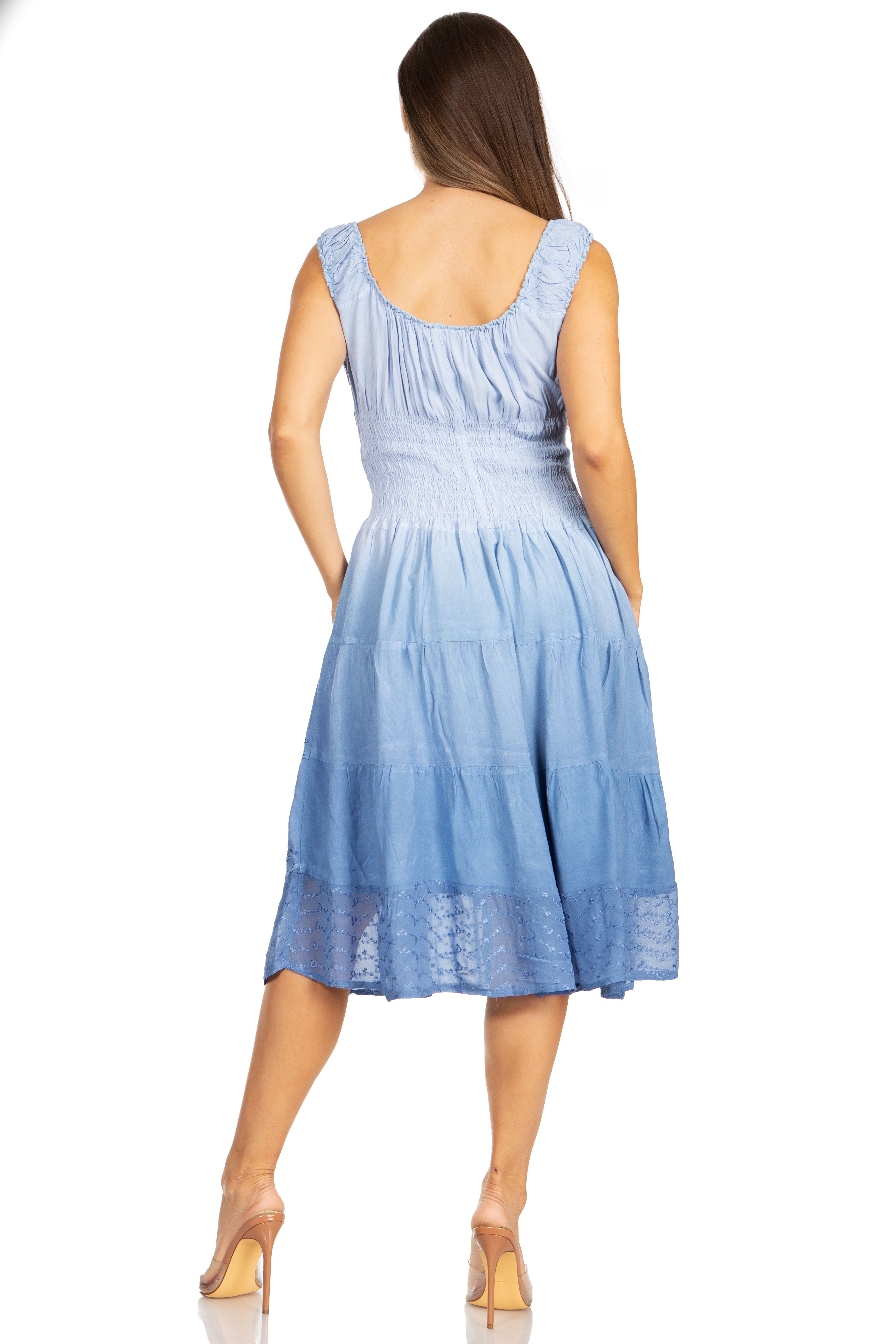 Woman wearing a light blue dress on a white background