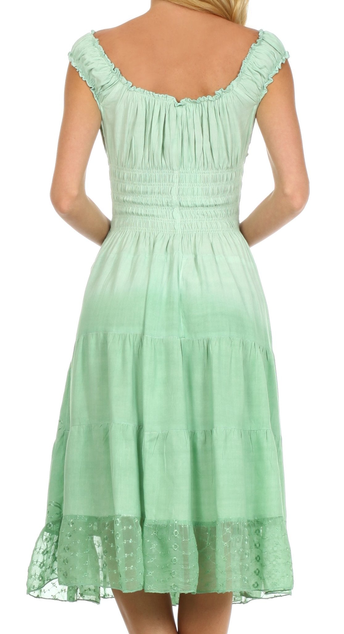Mint green dress with lace details on a white background