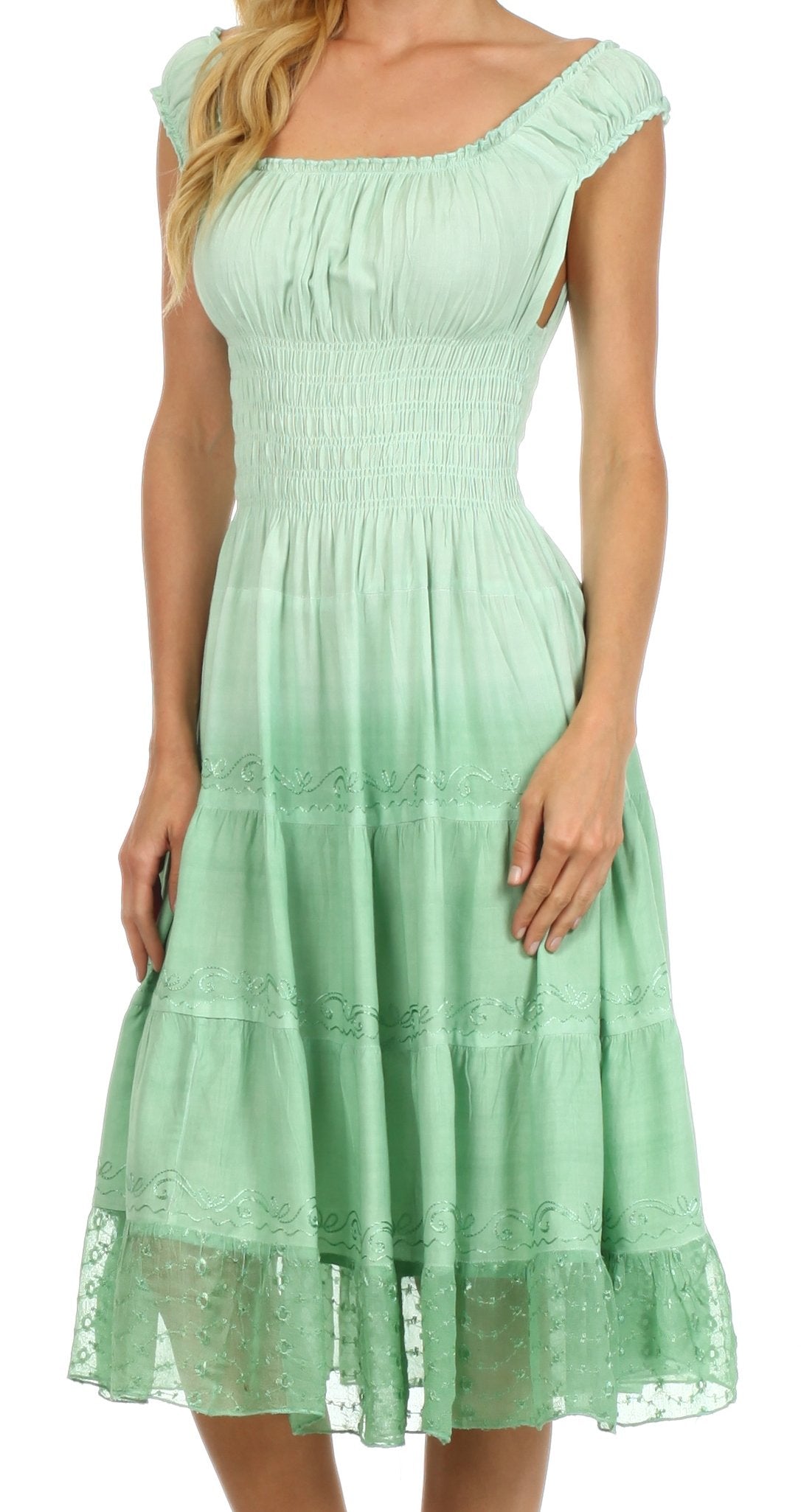 Mint green dress with lace details on a white background