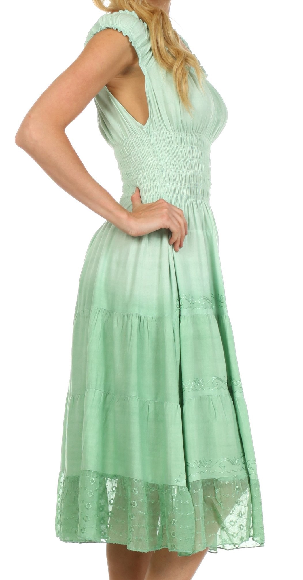 Mint green dress worn by a person on a white background