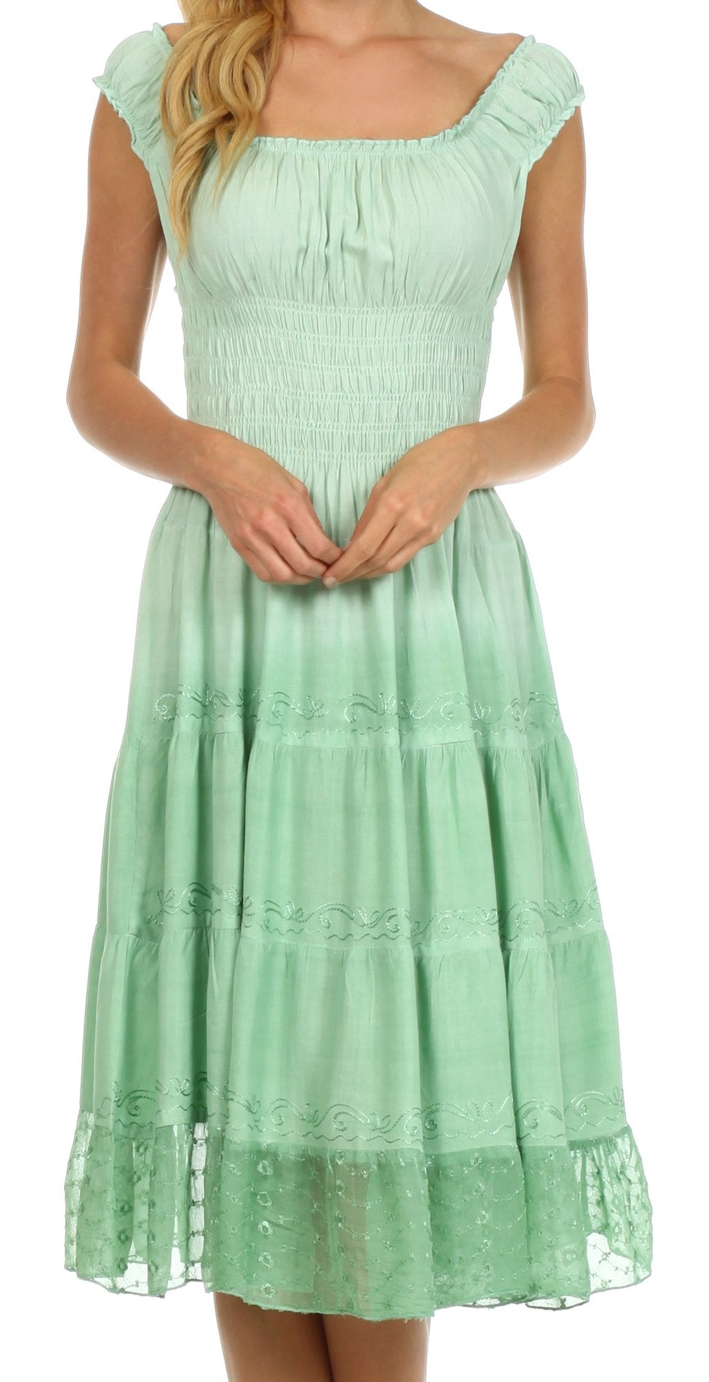 Mint green dress with lace details on a white background