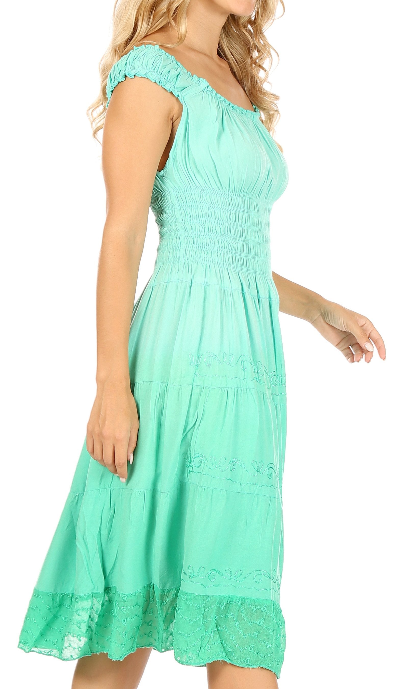 Mint green dress worn by a model on a white background