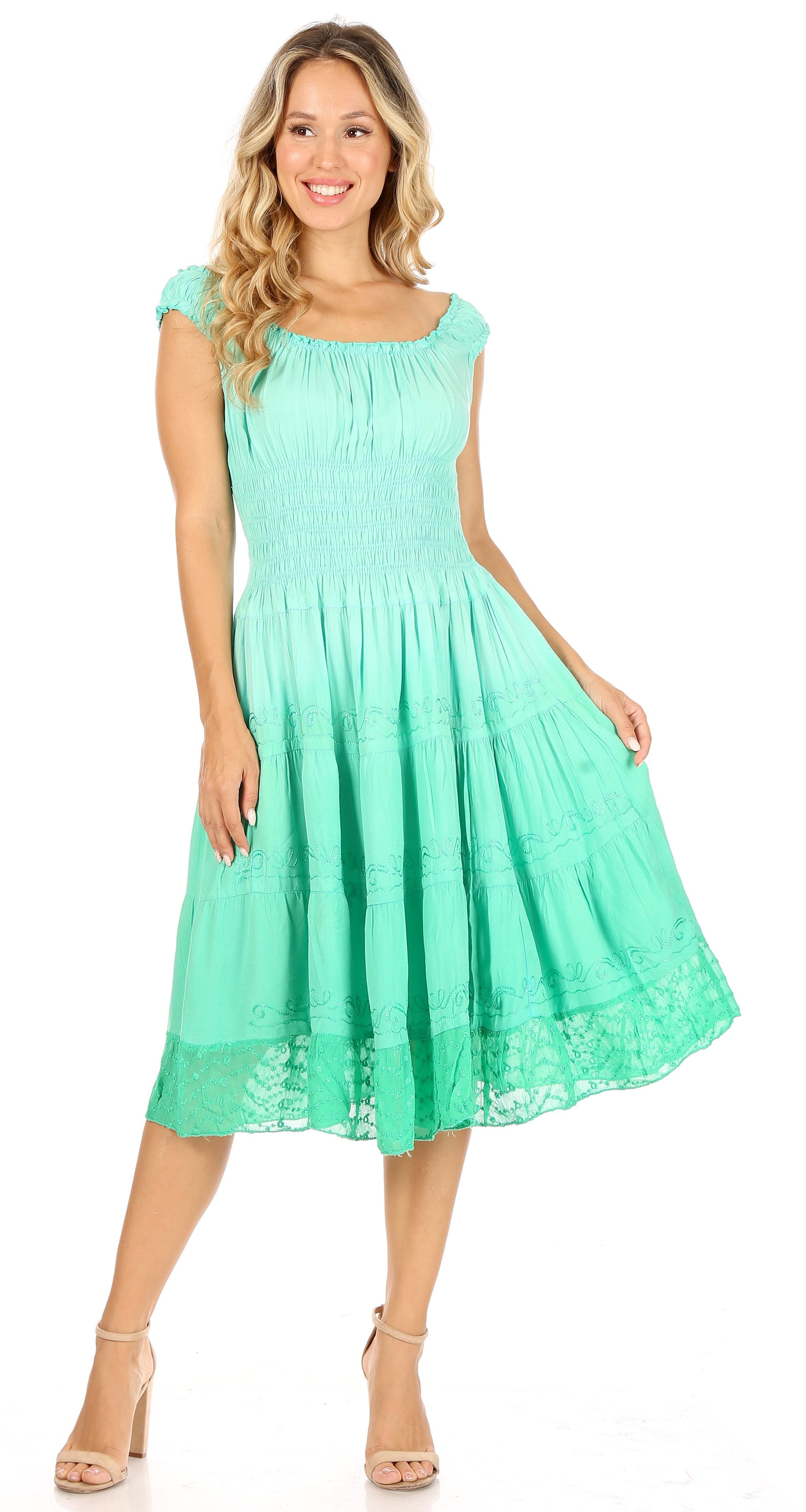 Woman wearing a mint green dress on a white background