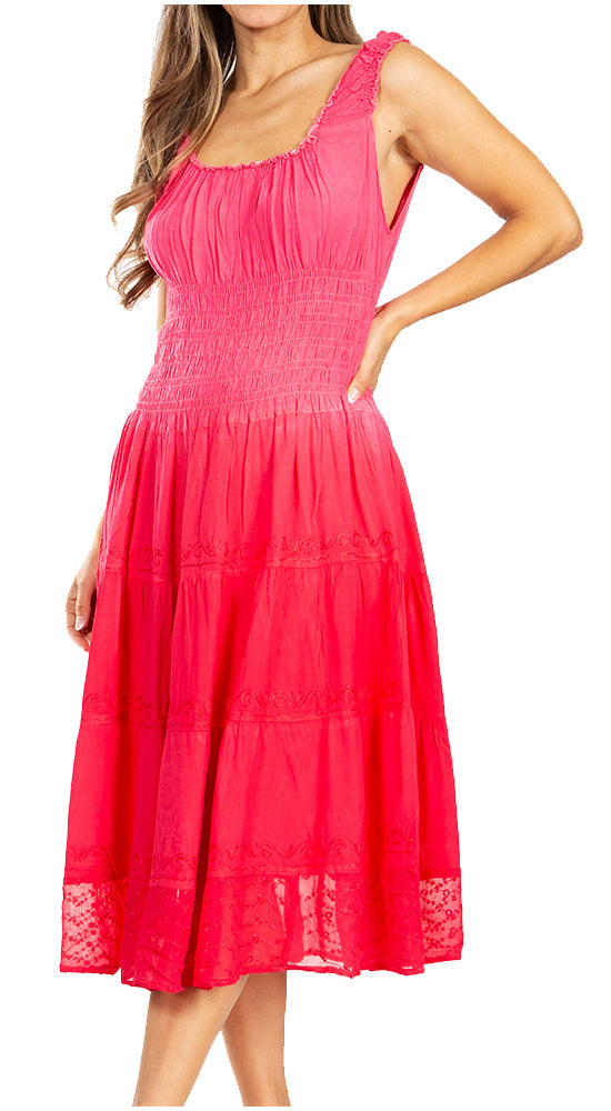 Woman wearing a bright pink dress with lace details on a white background