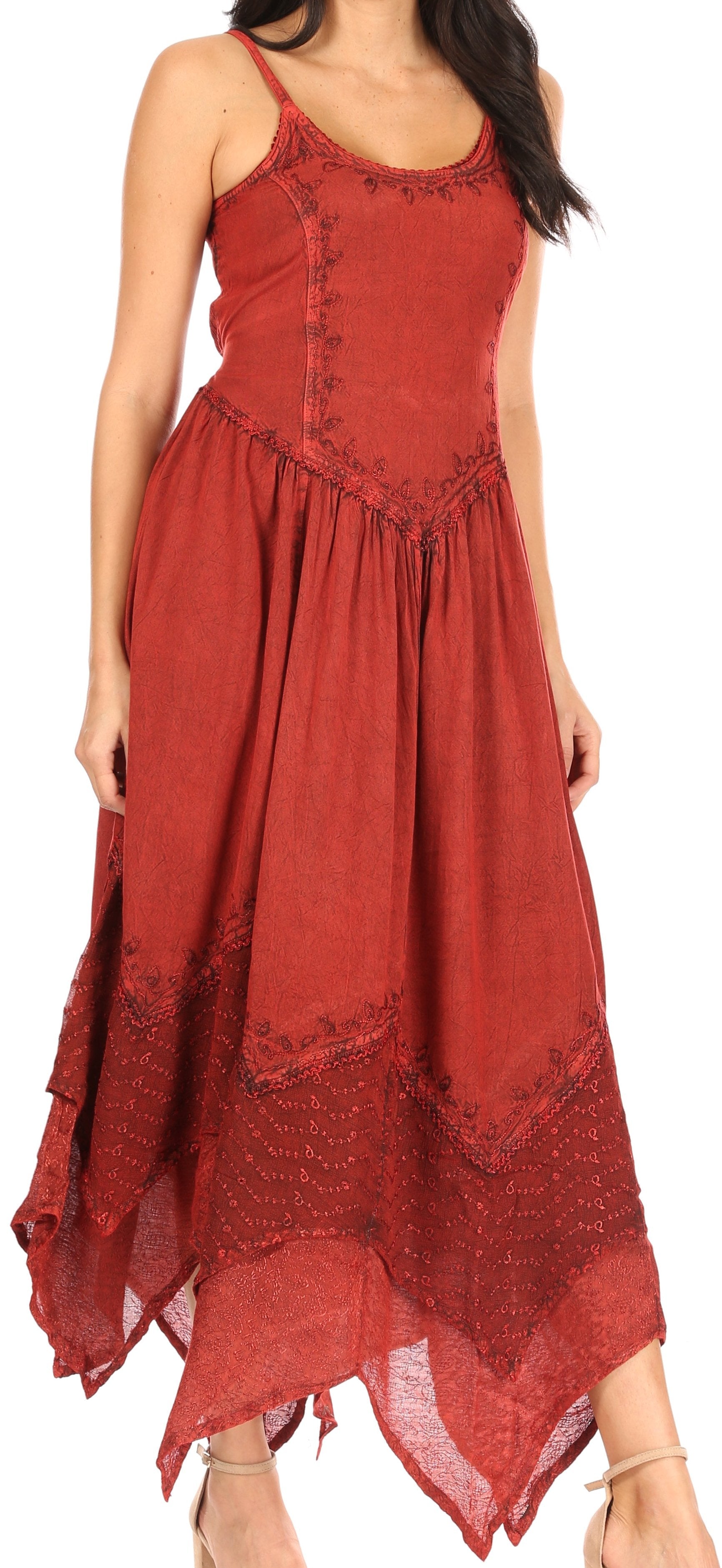 Red dress with lace details on a model against a white background