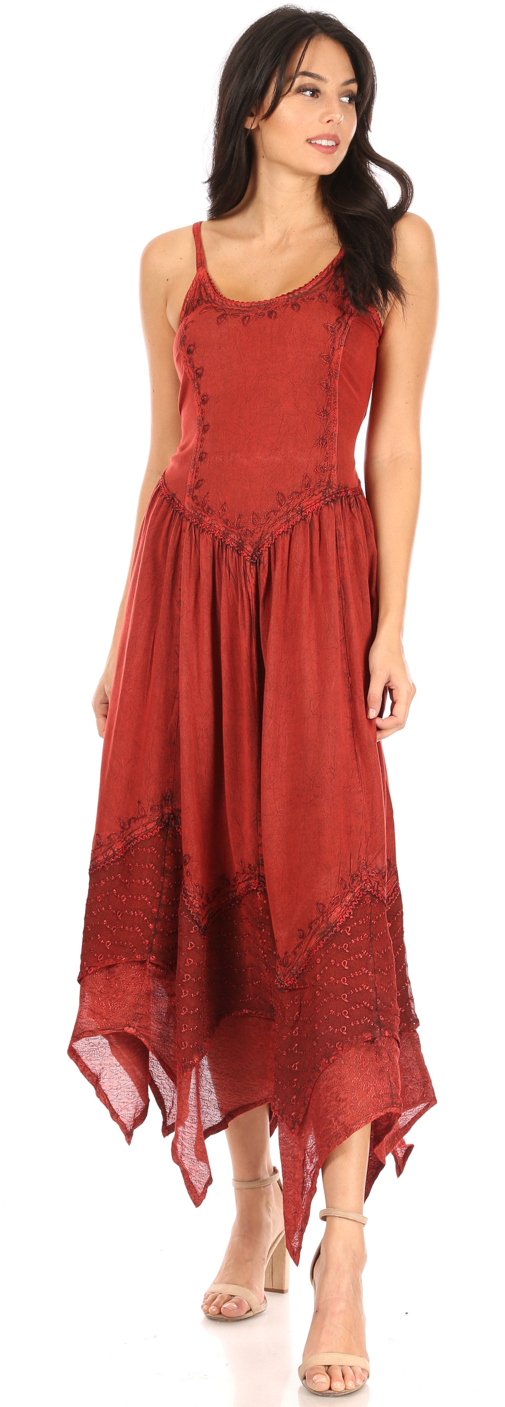 Woman wearing a red dress with lace details on a white background