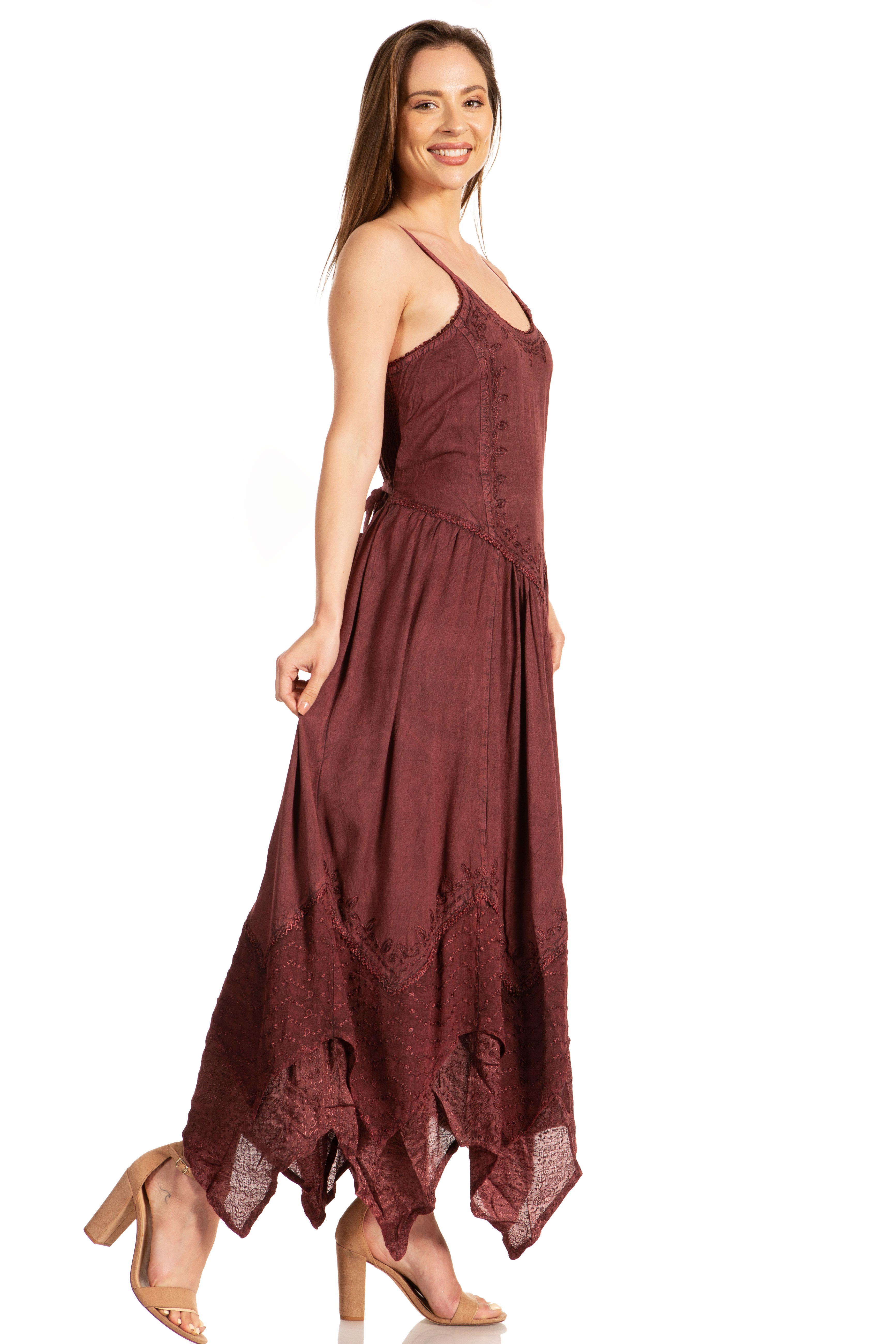 Woman wearing a burgundy one-shoulder dress on a white background