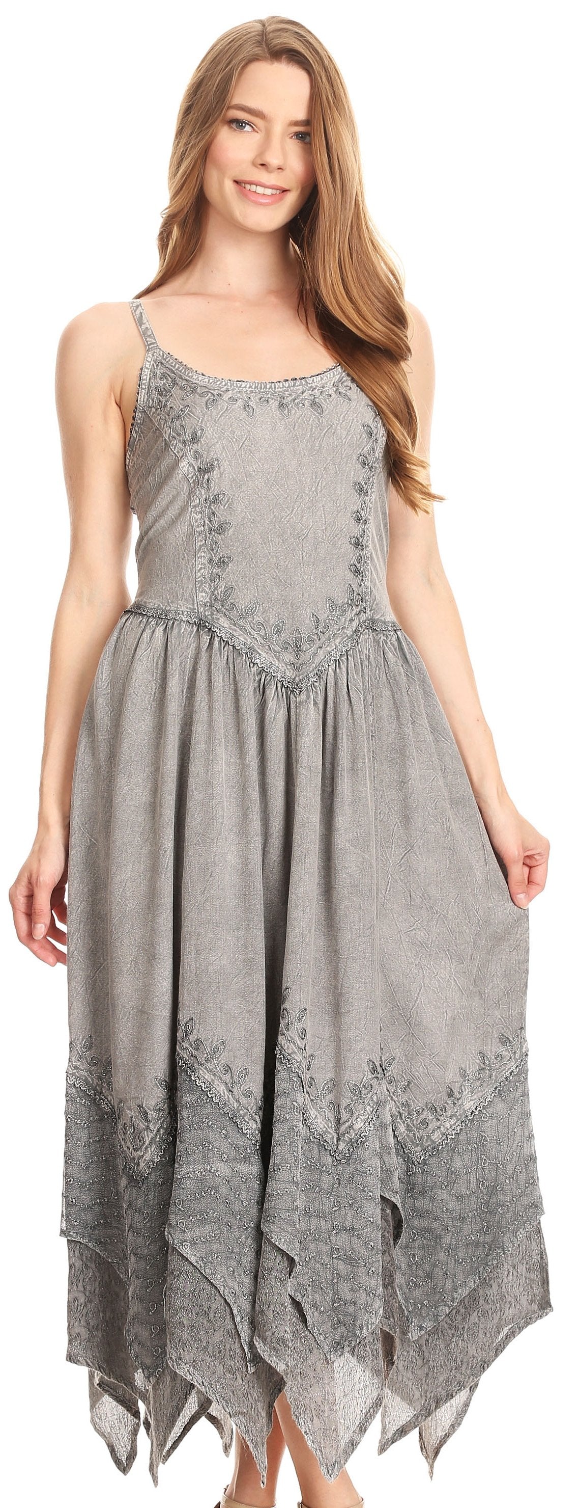 Woman wearing a gray dress with floral patterns on a white background